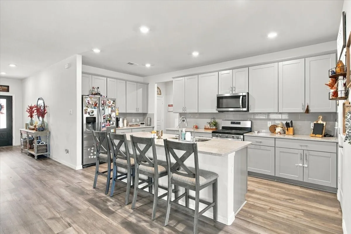 Kitchen and partial front entry view