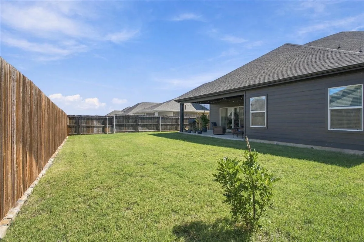 Back yard with covered patio view