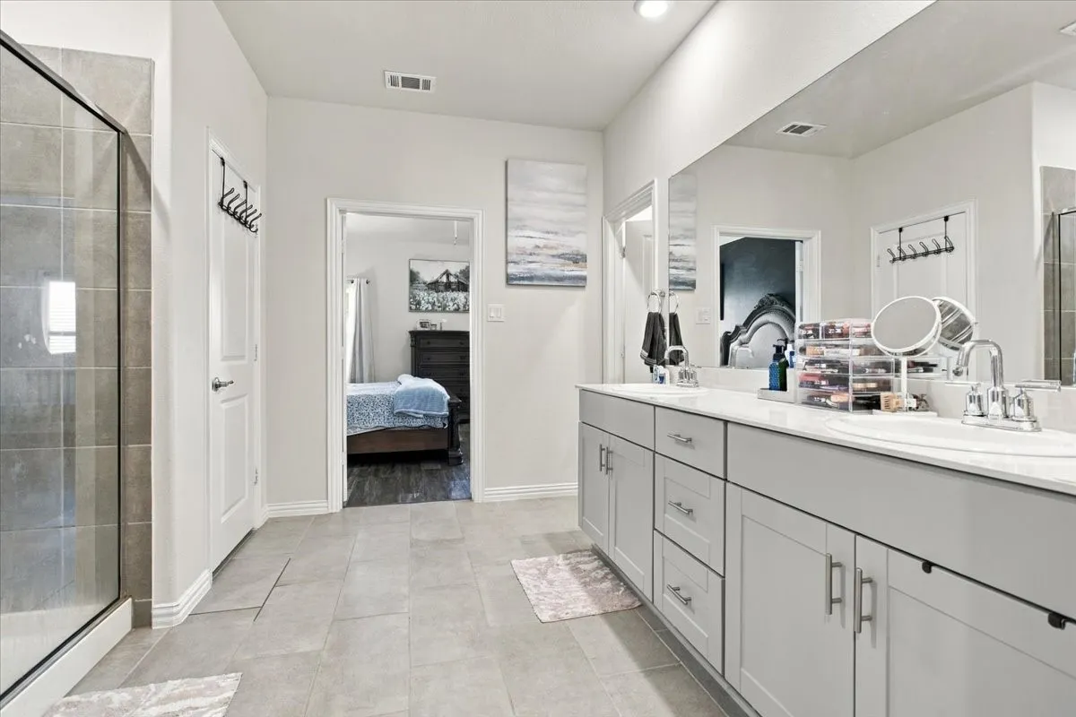 Master bathroom w-double sinks and large tile shower