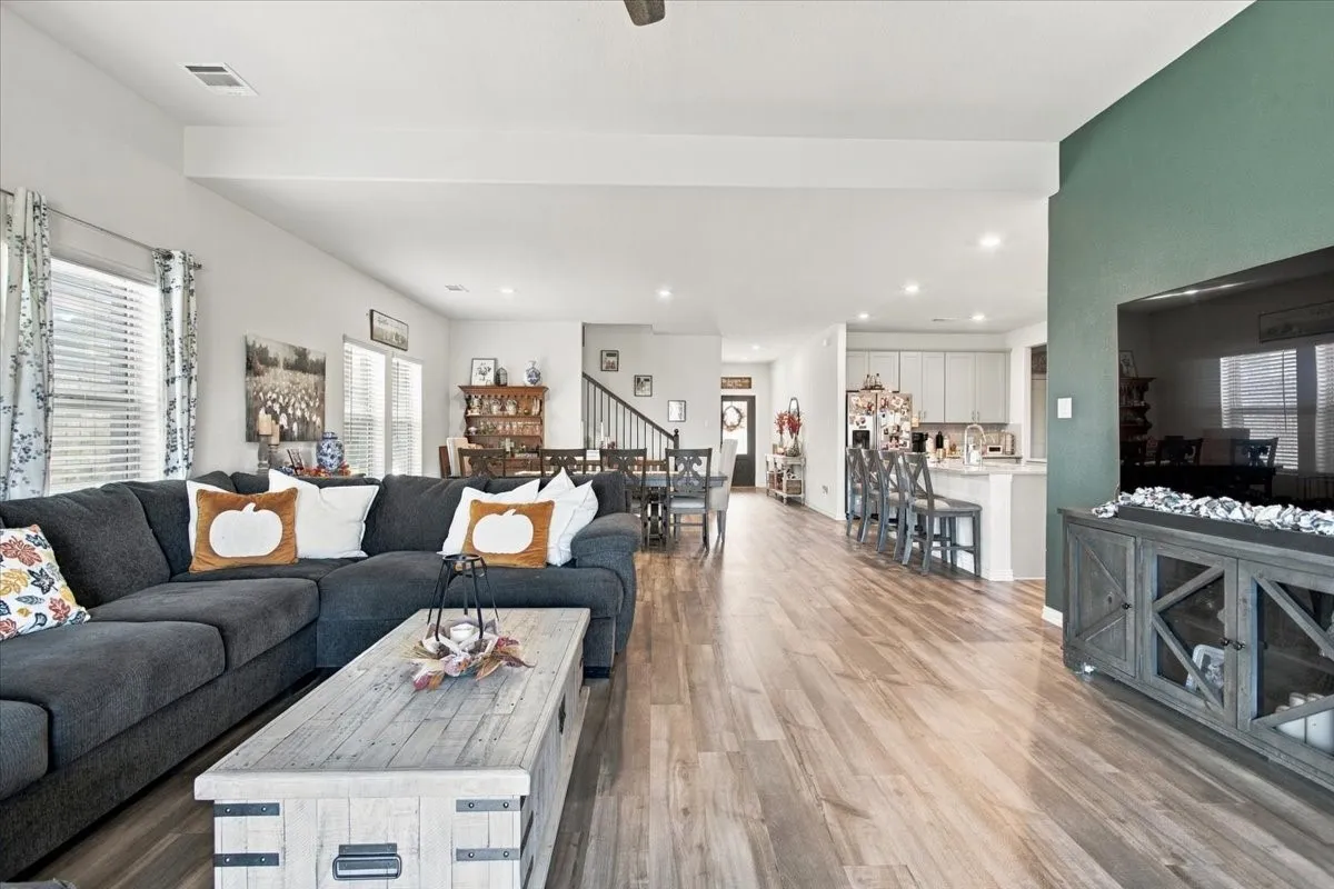 Family room with open floor plan; dining area, kitchen and front entry view
