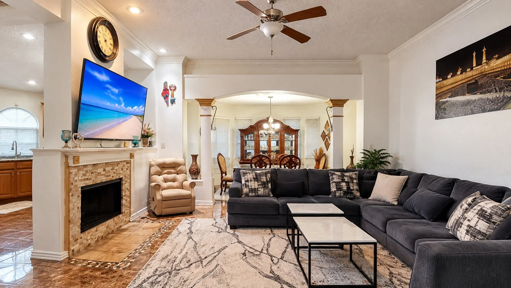 Fireplace with a stone tile surround and white mantel