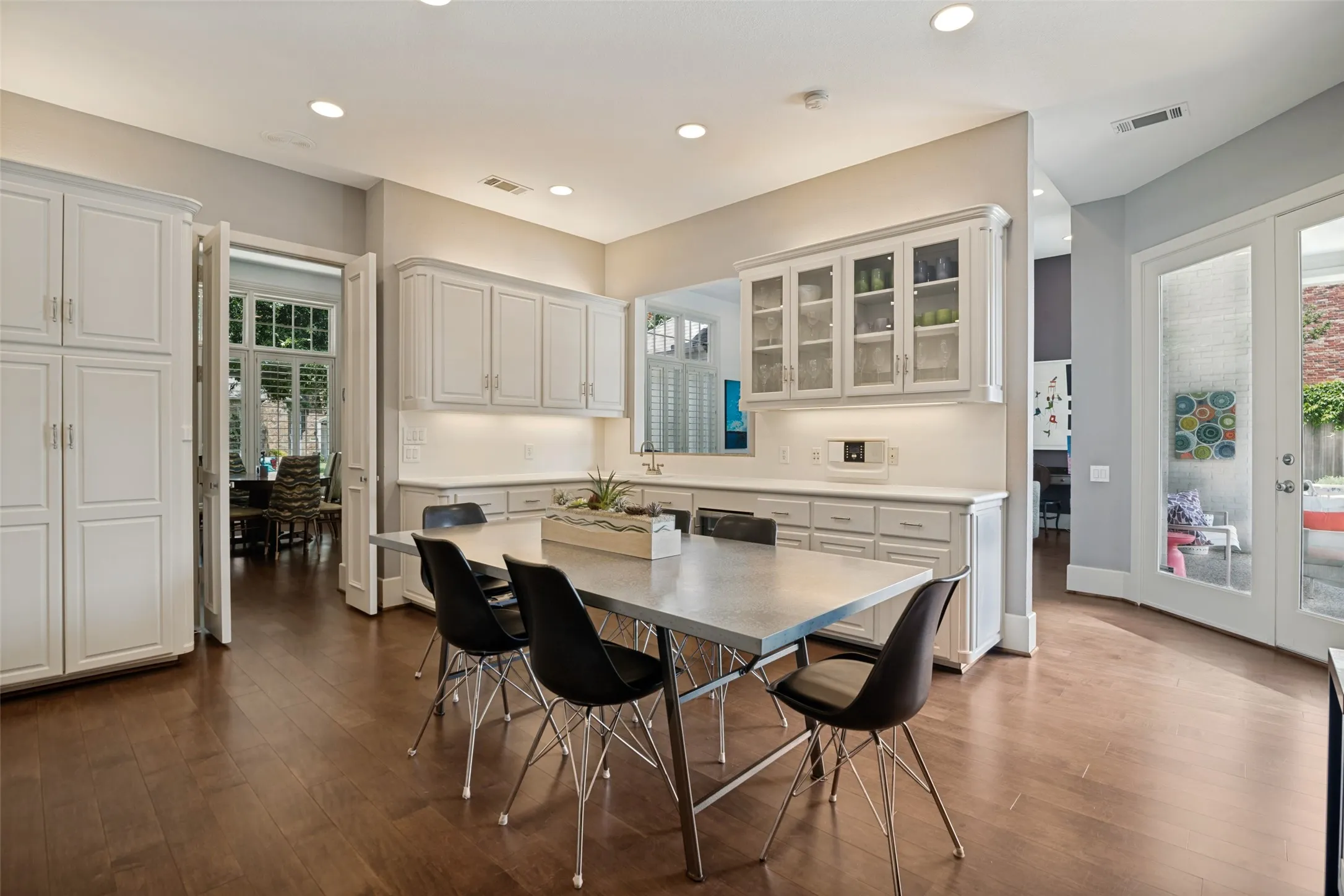 The perfect gathering spot...open to the dining room, wet bar serving area open to the living room and access to the patio!
