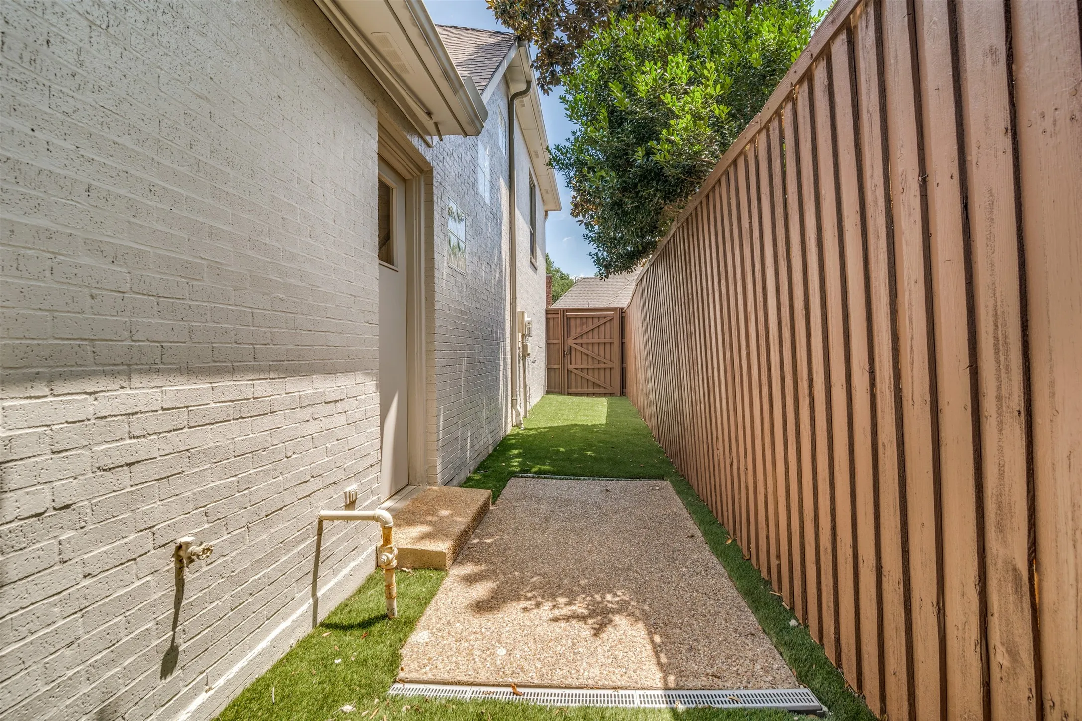 Turf side yard off the kitchen is ideal for pets!