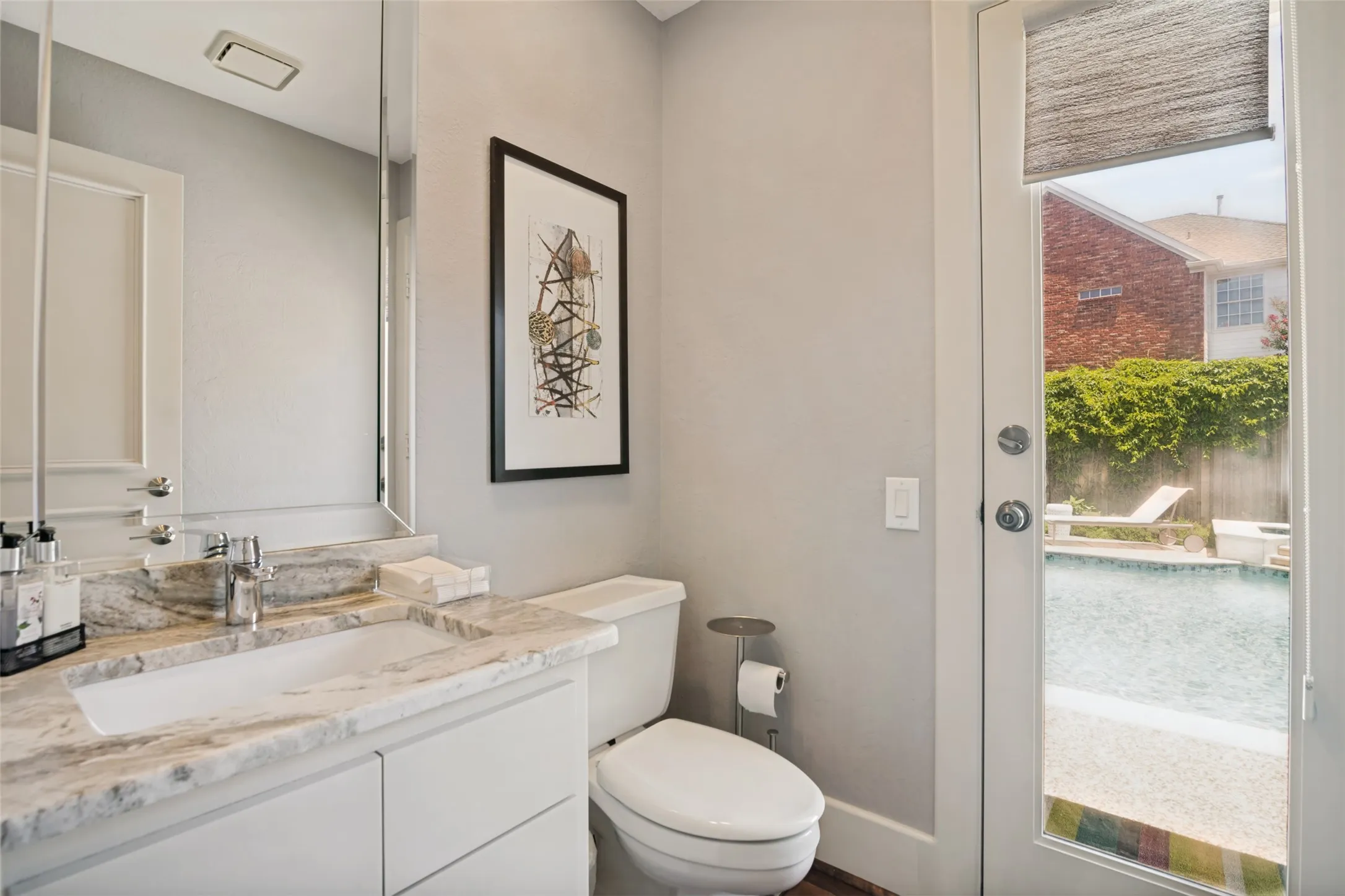 Pool bath! This half bath is located just off the family room...convenient for guests and swimmers!