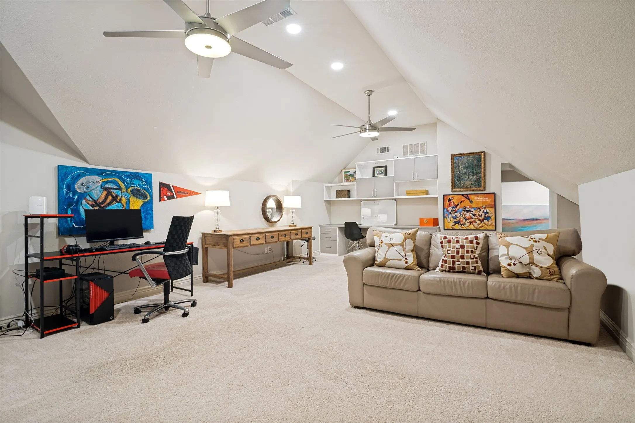 Opposite view of the game room with desk space built into the wall unit.