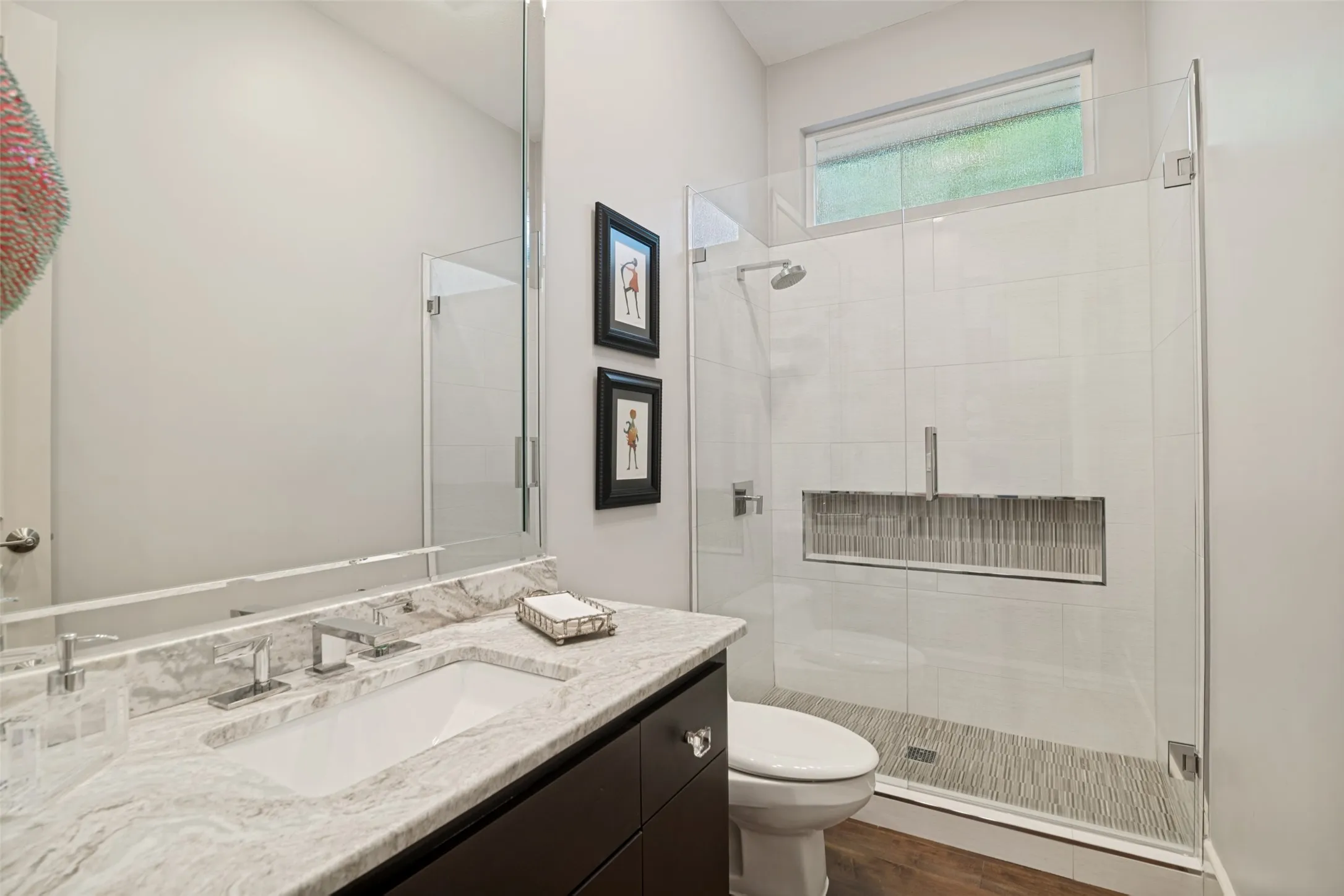 This updated full bath is just a few steps from the fourth bedroom (current study) downstairs.