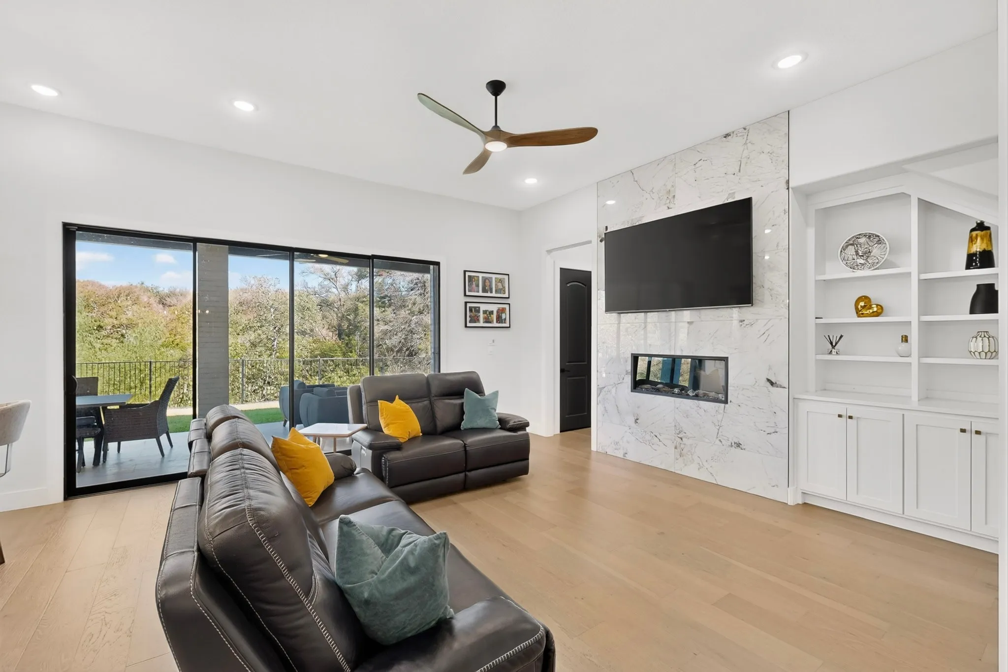 Hardwood-finish flooring, recessed lighting, and a ceiling fan