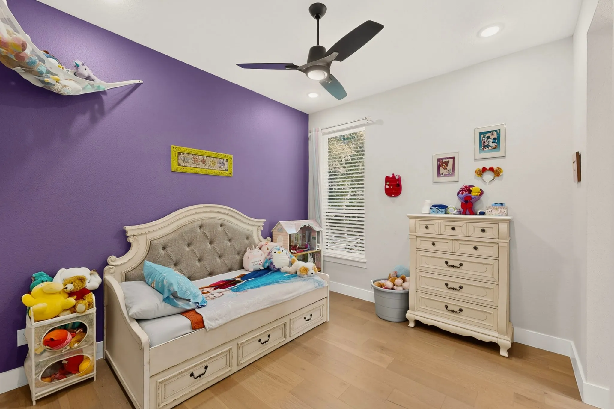 Wood-finish flooring, recessed lighting, and a modern ceiling fan with integrated lighting
