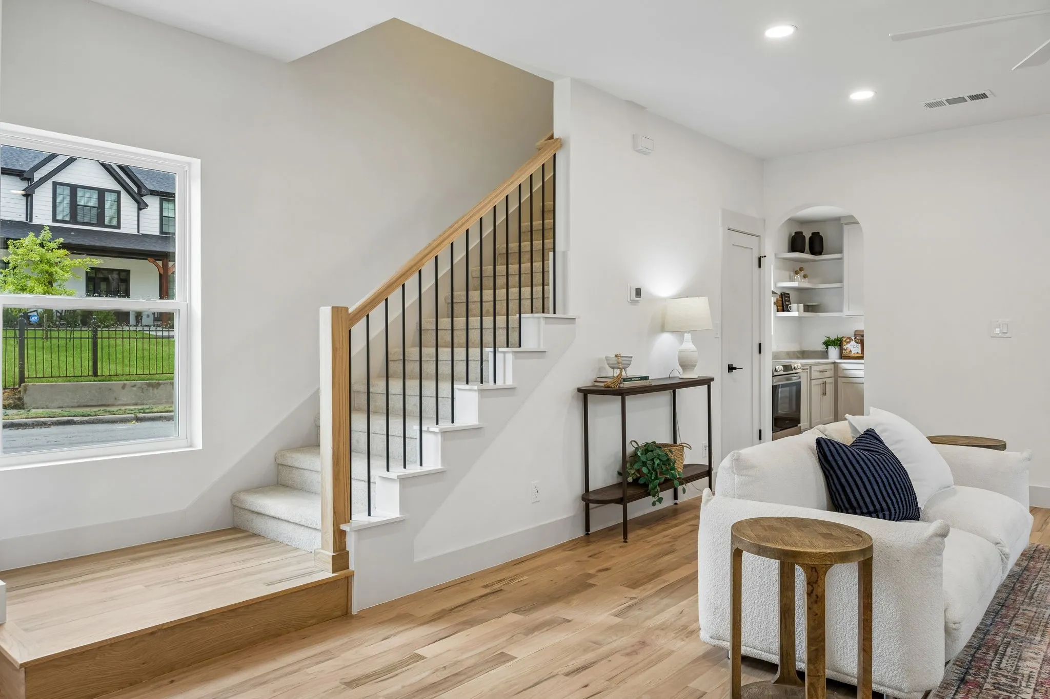 The landing and stairs are bathed in natural light.
