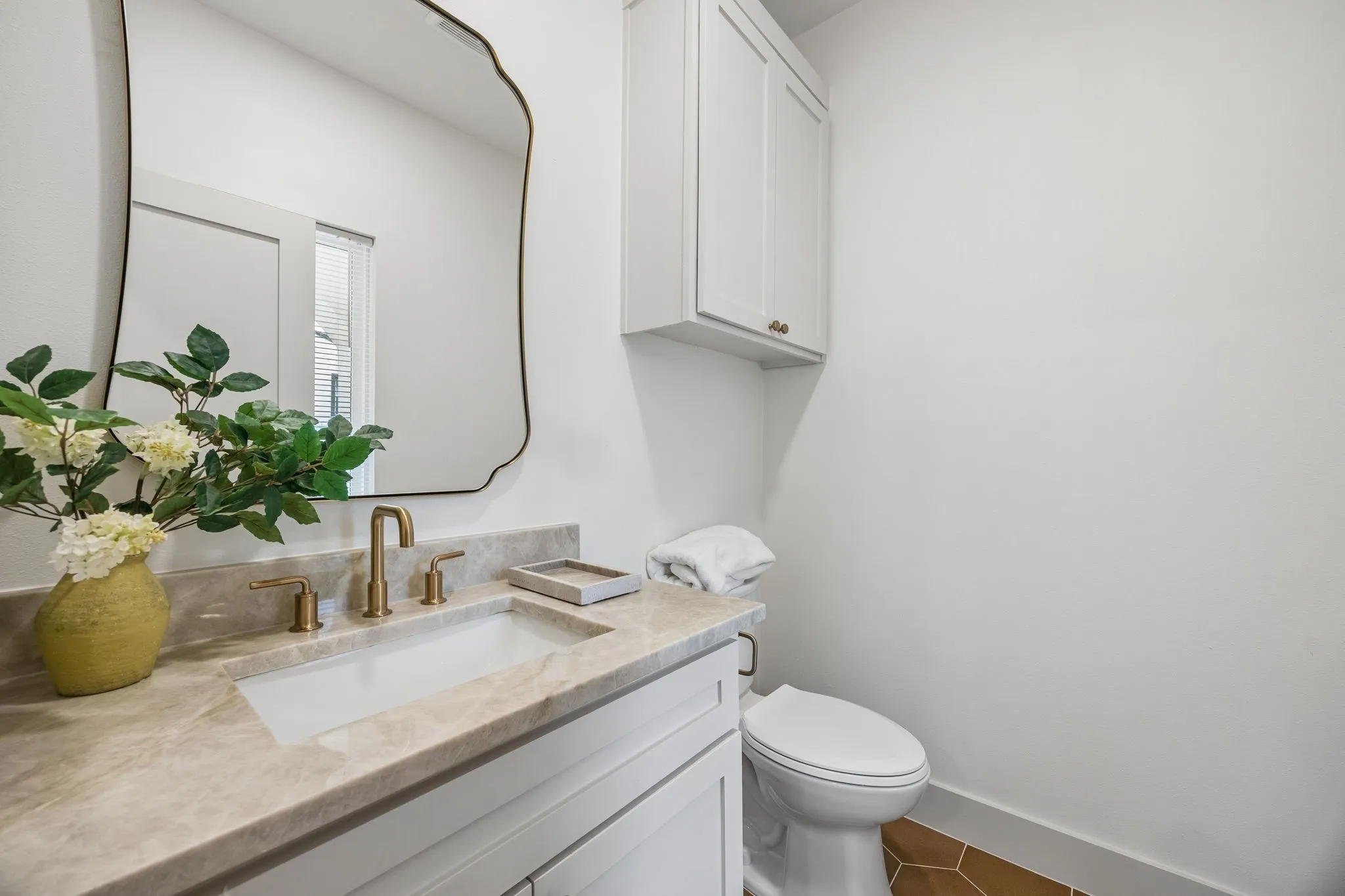 Half bathroom with light-colored countertop