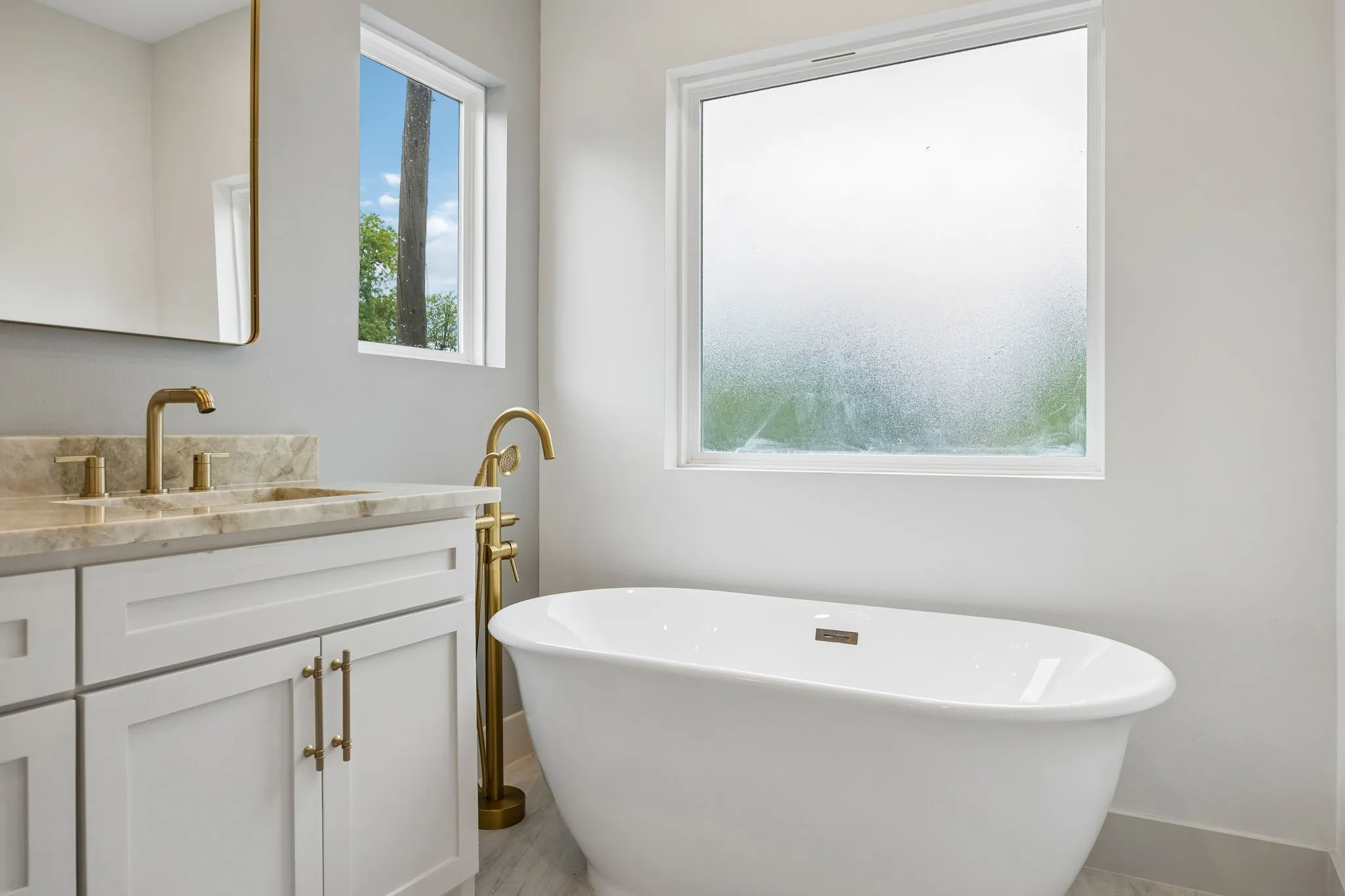 Freestanding soaking tub is just waiting for you to relax in after a stressful day!