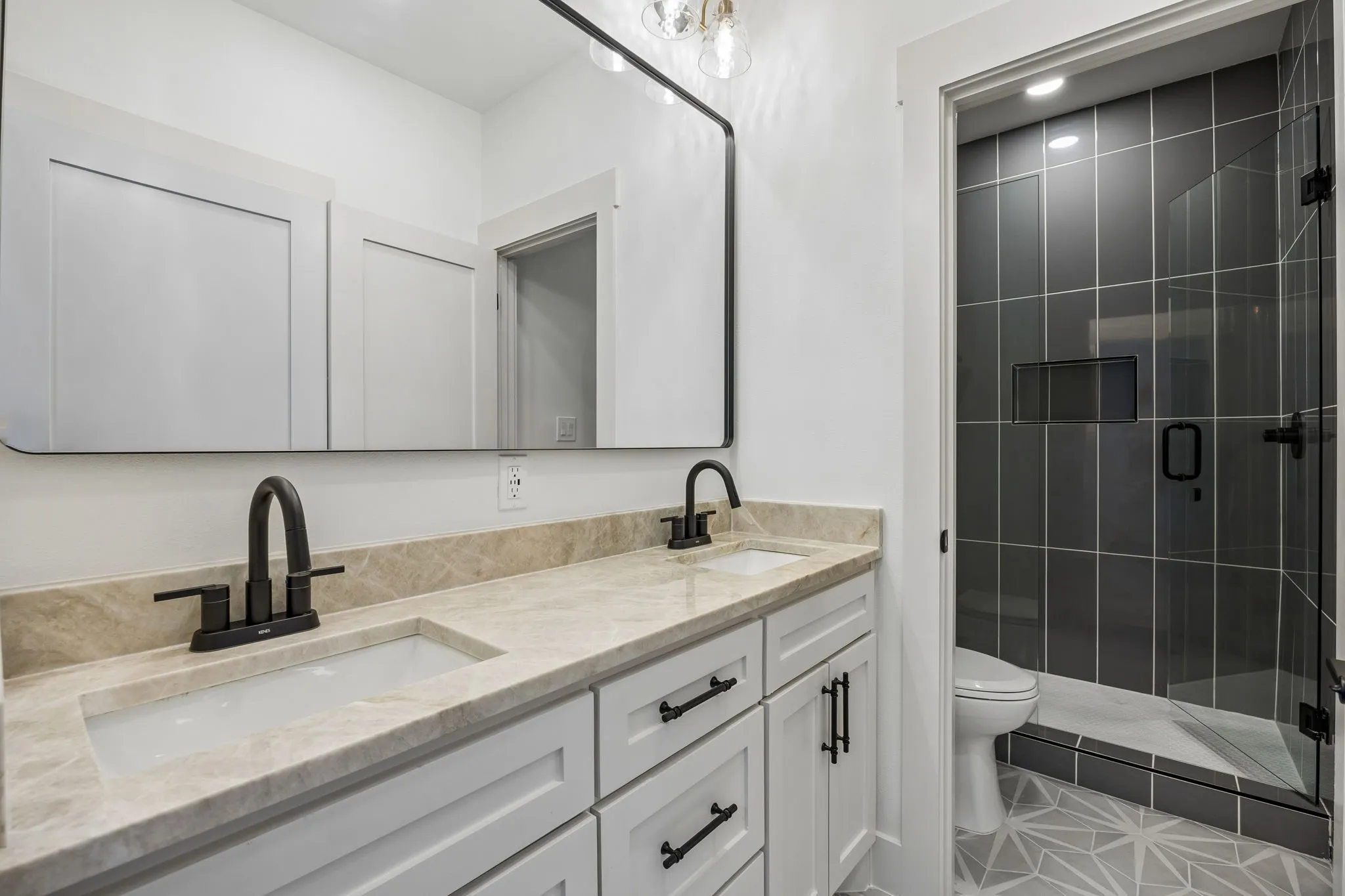 Full jack and jill bathroom with 2 sinks.