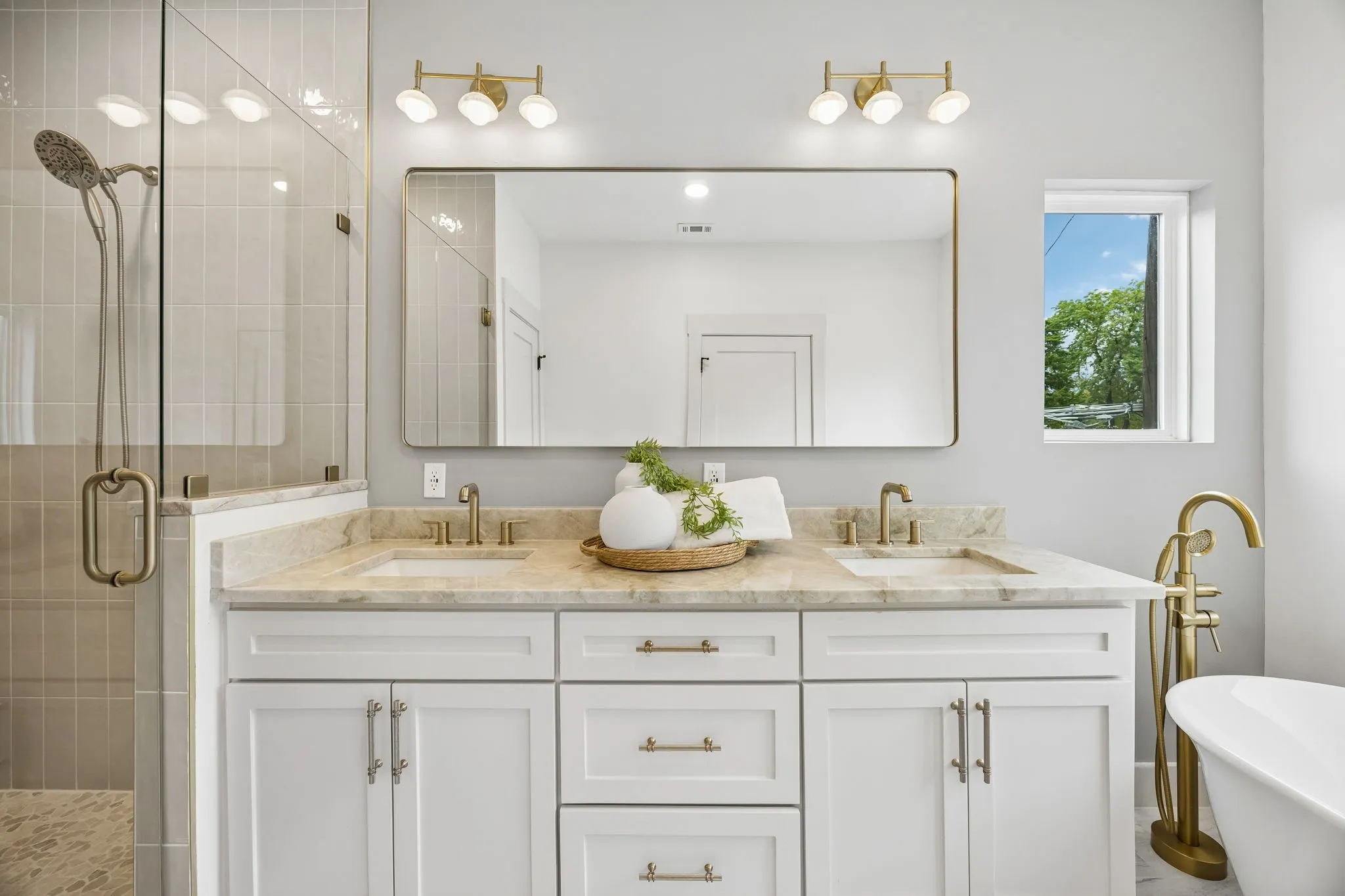 A large vanity with 2 sinks in the ensuite primary bathroom