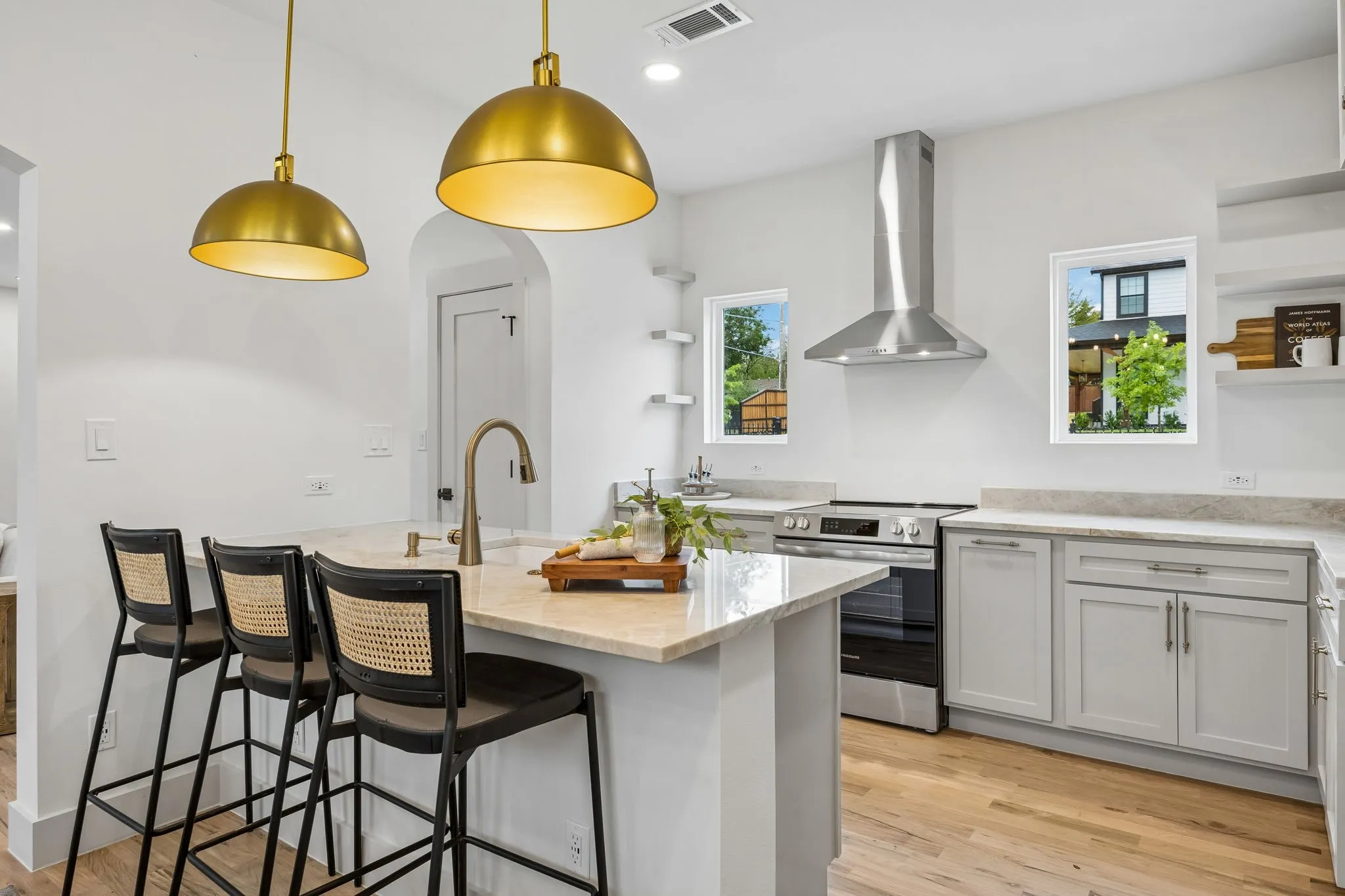 Kitchen featuring a large central island, stainless steel appliances and recessed lighting
