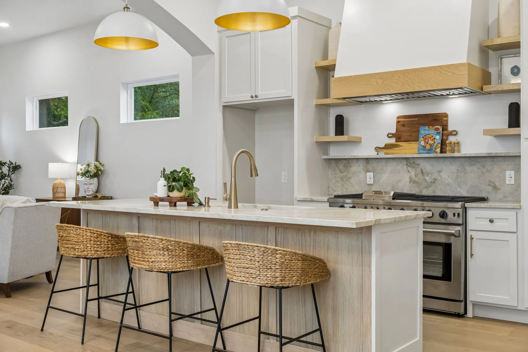 Contemporary kitchen featuring stainless steel appliances including a gas range
