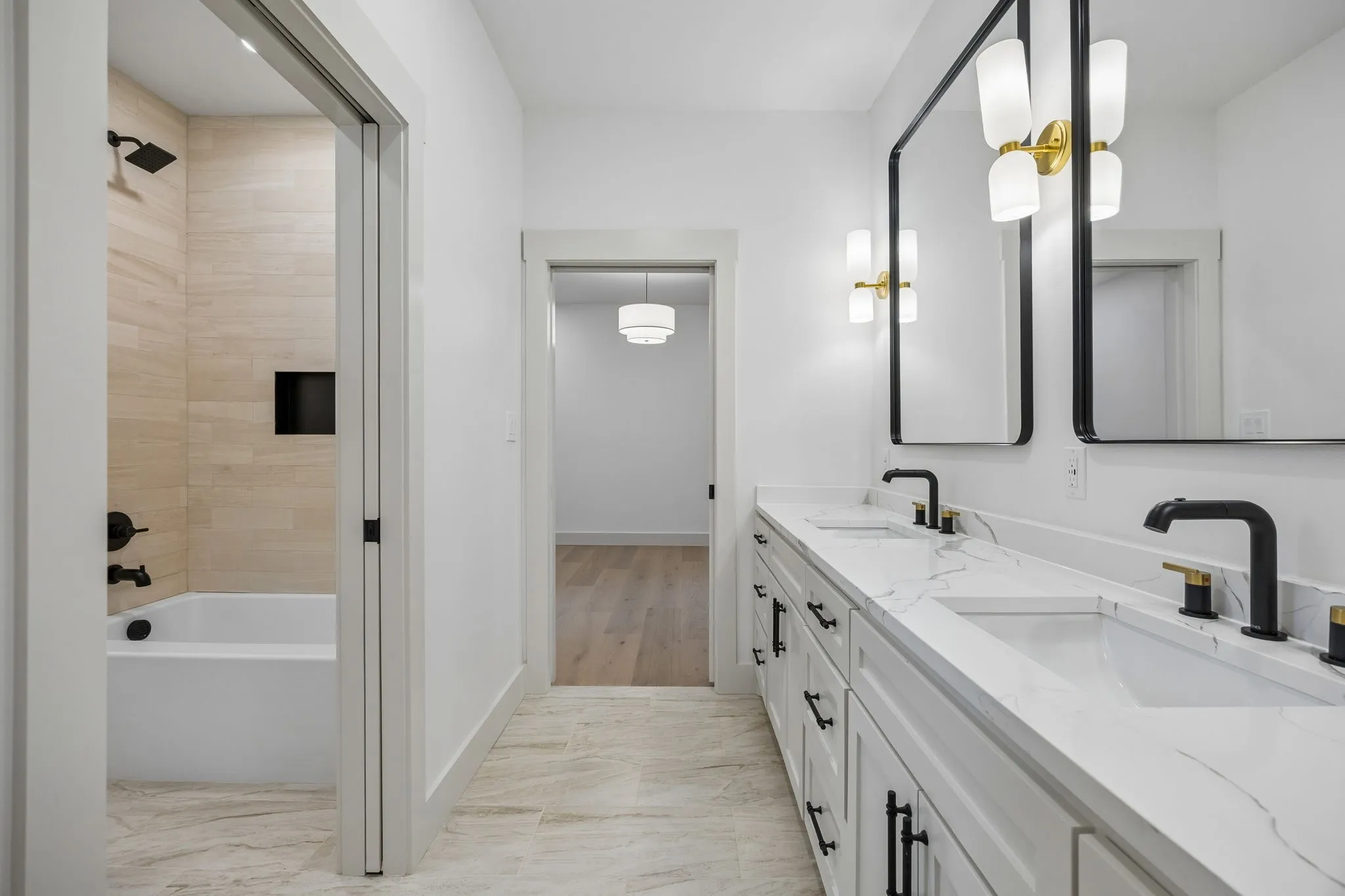 Dual vanity with white cabinetry and quartz countertops