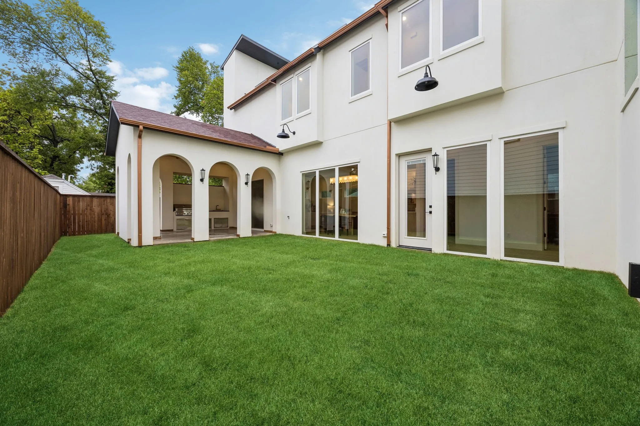 Back yard with wooden privacy fence.