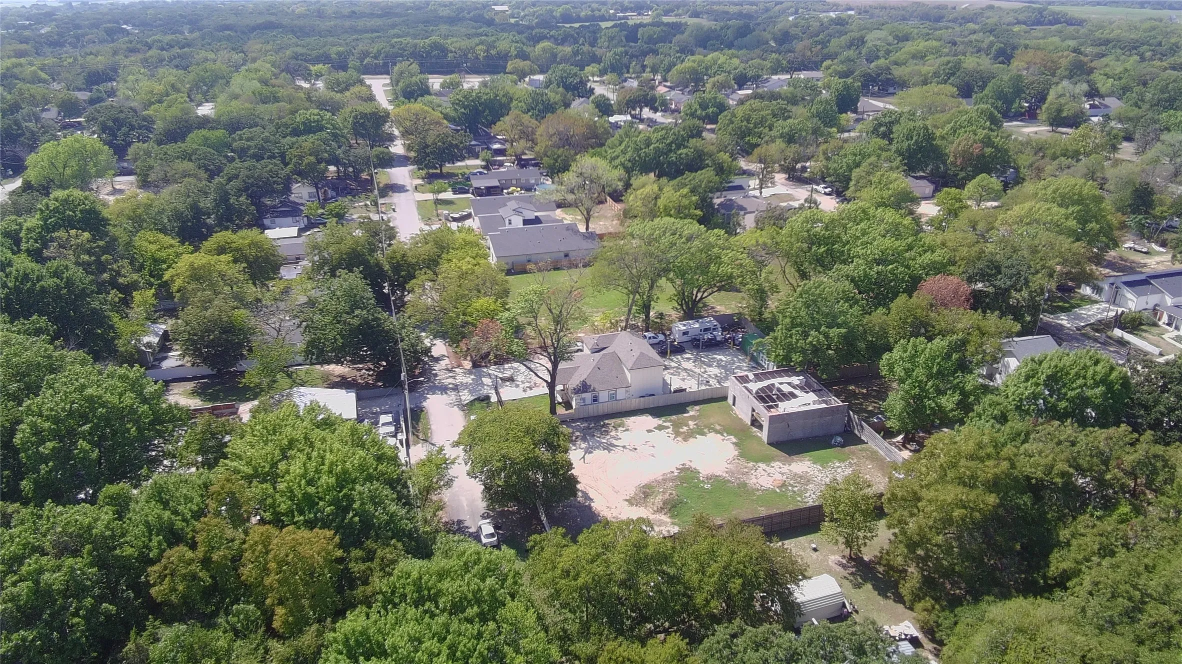 Aerial view of adjacent lots; boundaries not depicted.