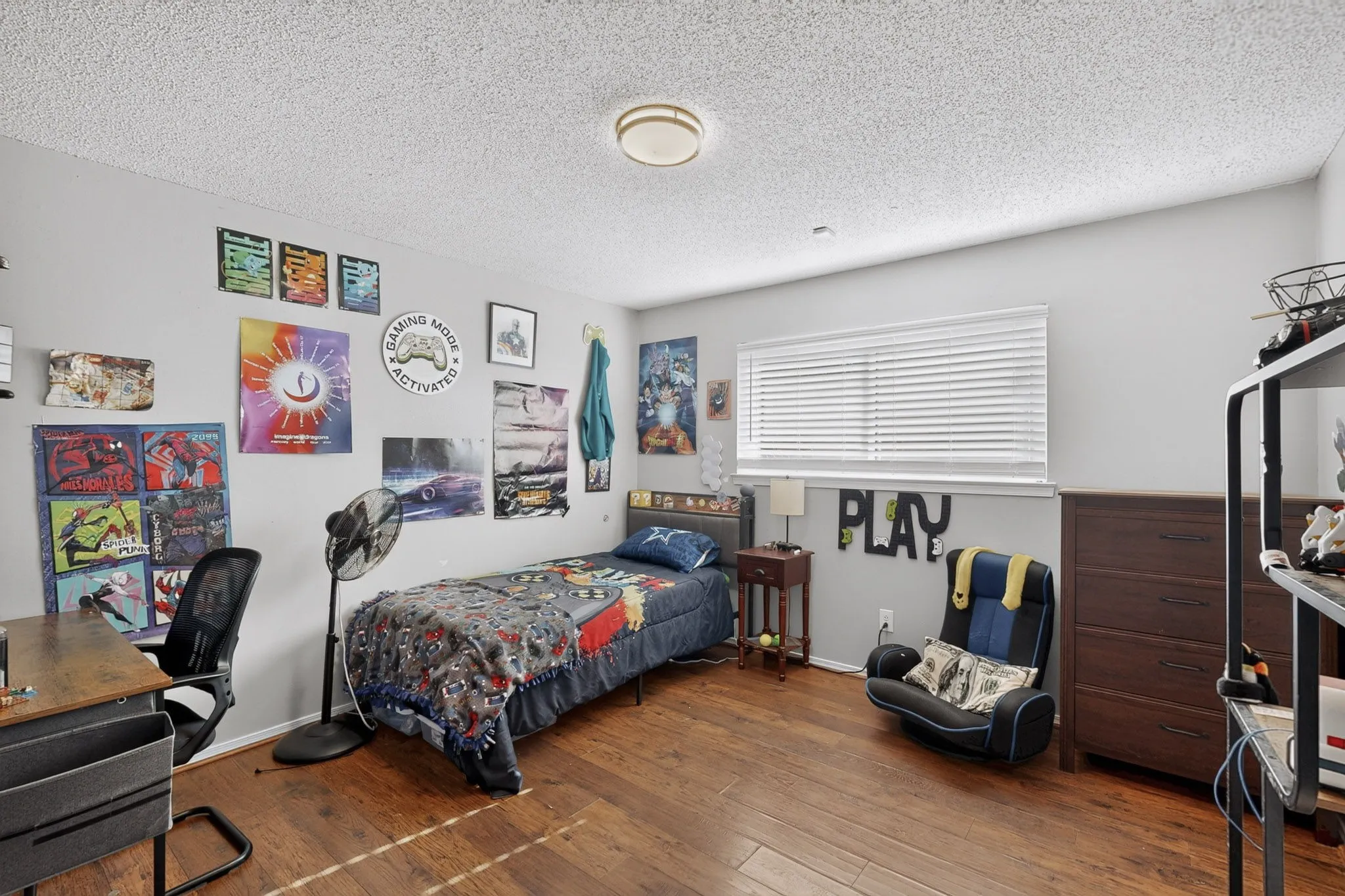Wood-finish flooring, single window with blinds, wood paneling, and a flush mount ceiling light
