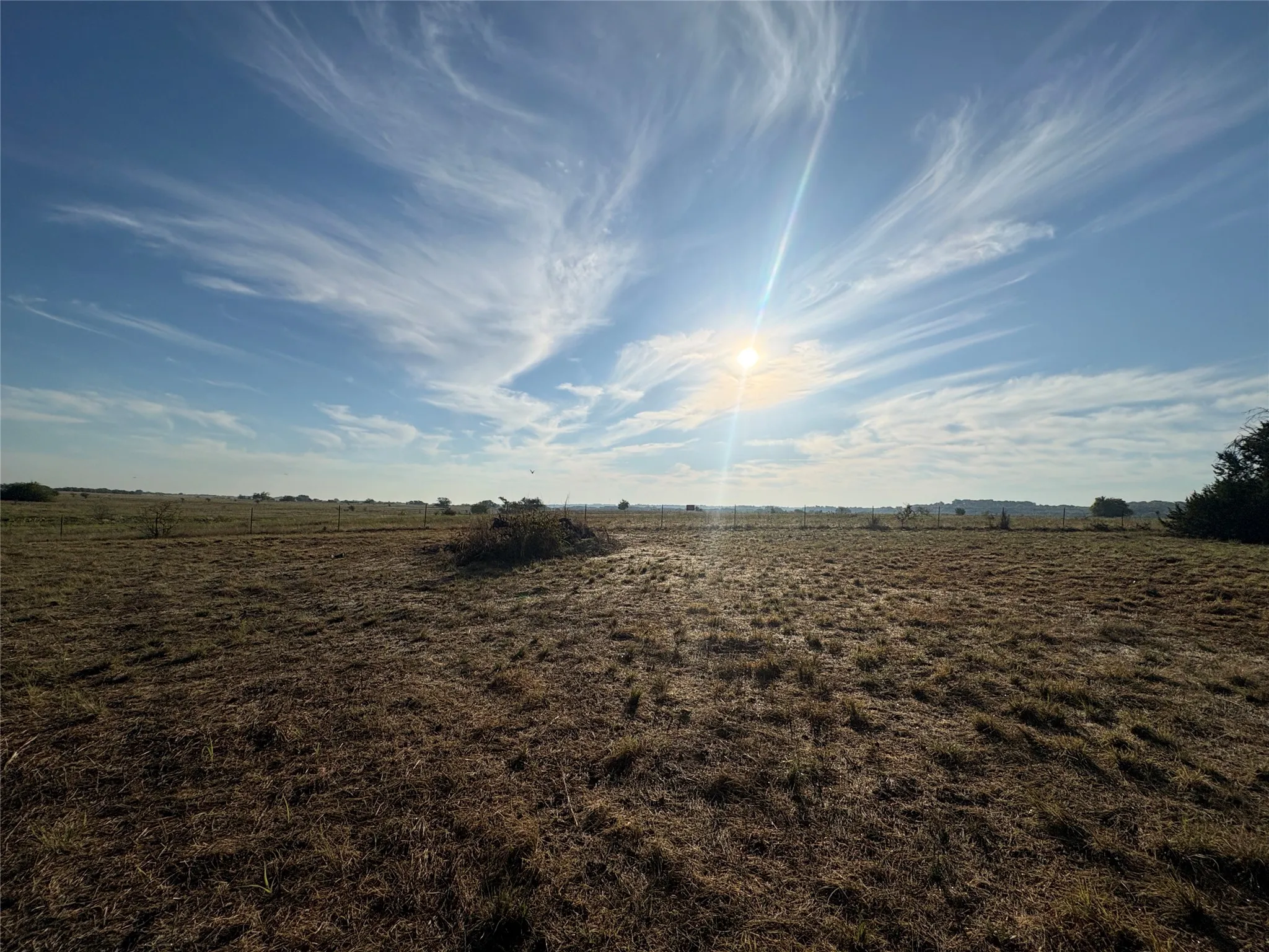 Expansive open field under a clear sky