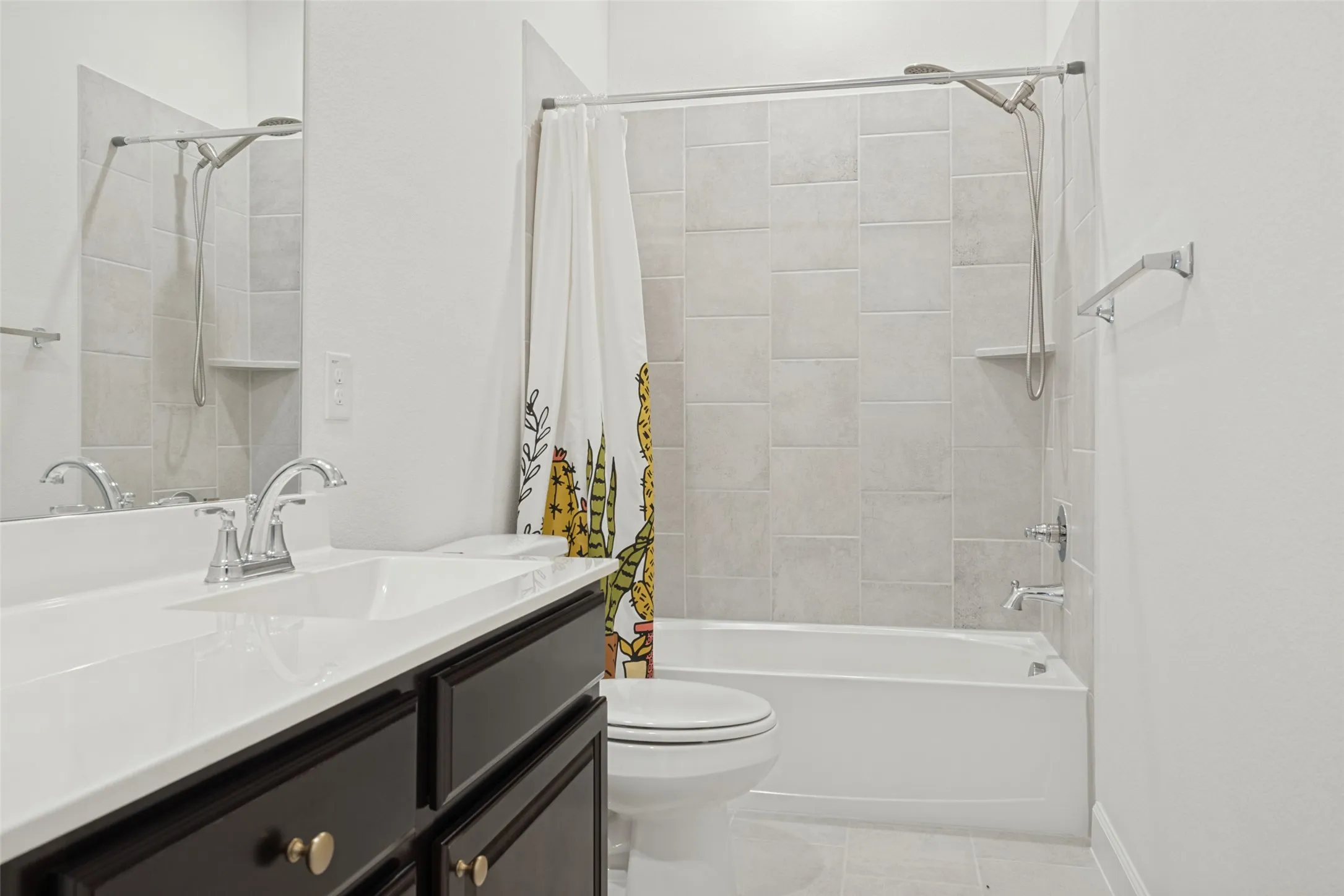 Vanity with white countertop, chrome faucet, and dark wood-finish cabinetry