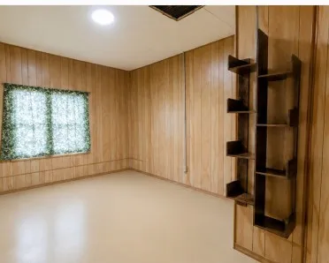 Wood-finish paneling, window, recessed lighting, built-in shelving, light-toned flooring