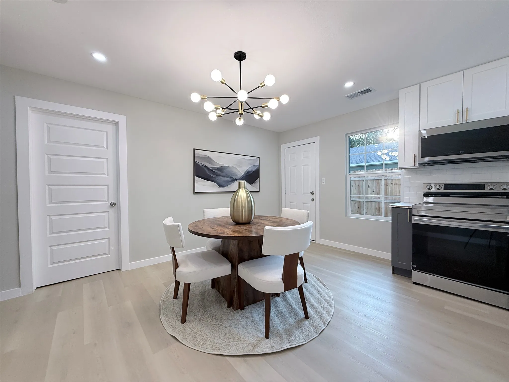 Light wood-finish flooring with recessed lighting