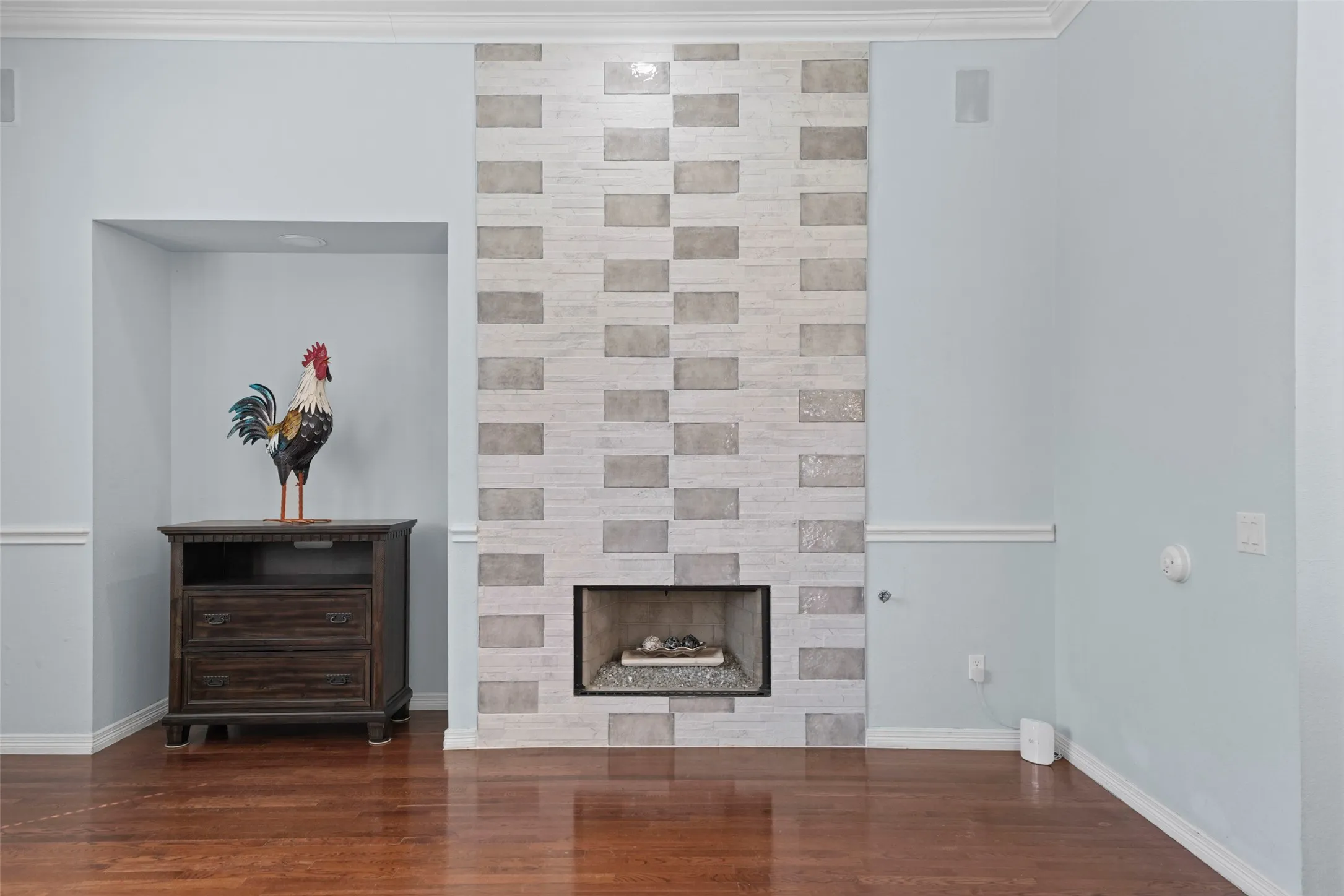 Fireplace facade features designer tile floor to ceiling