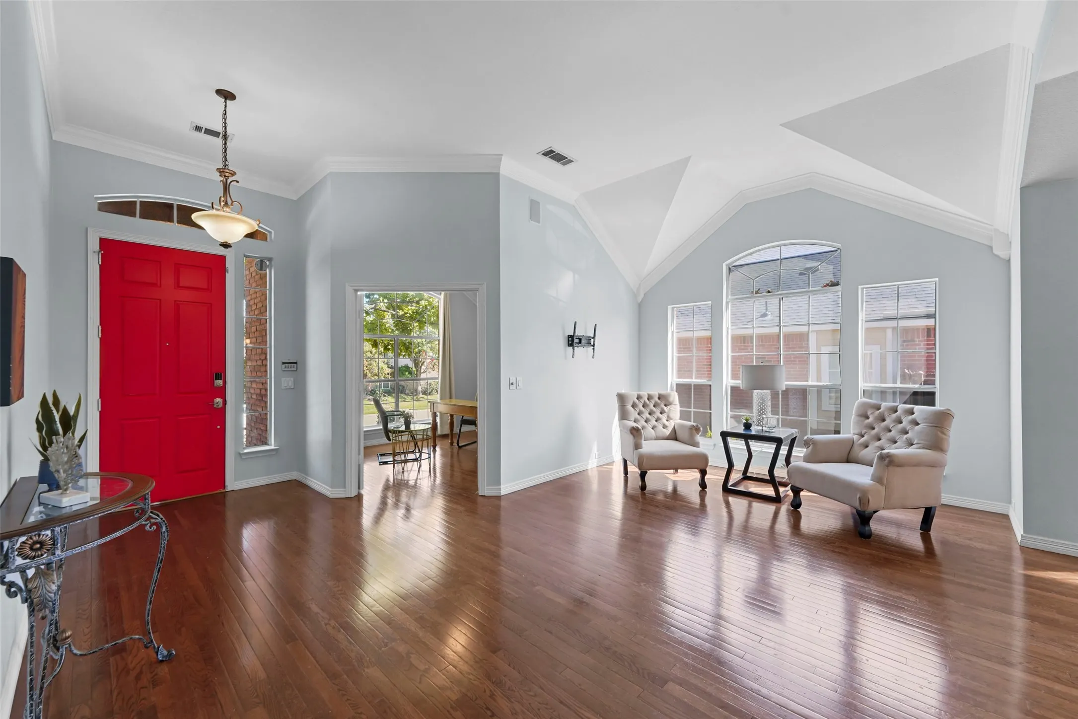 Foyer opens to formal living and dining areas