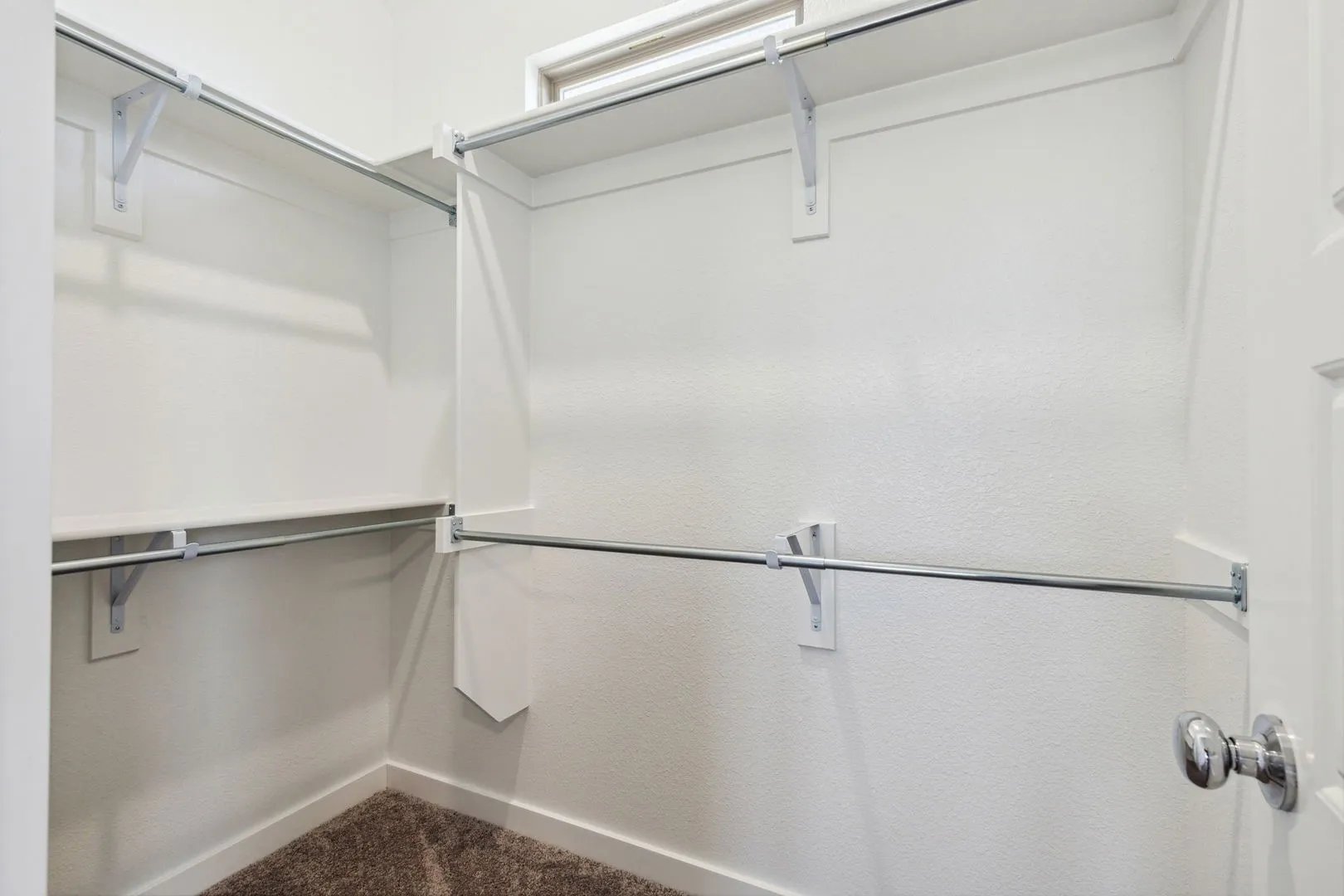 Primary Closet in the Ash home plan – REPRESENTATIVE PHOTO