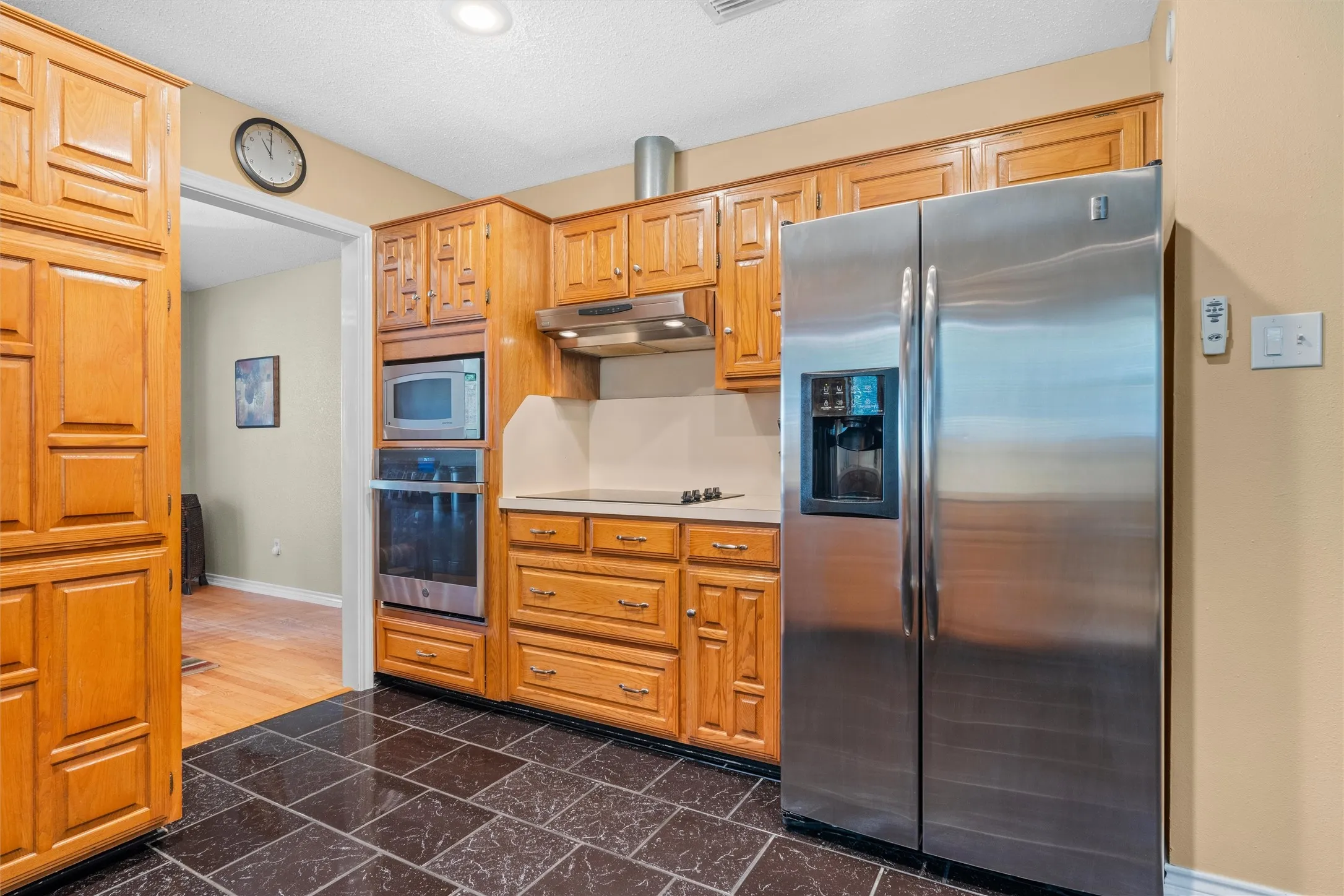 All stainless appliances plus flat cook top and stainless vent.