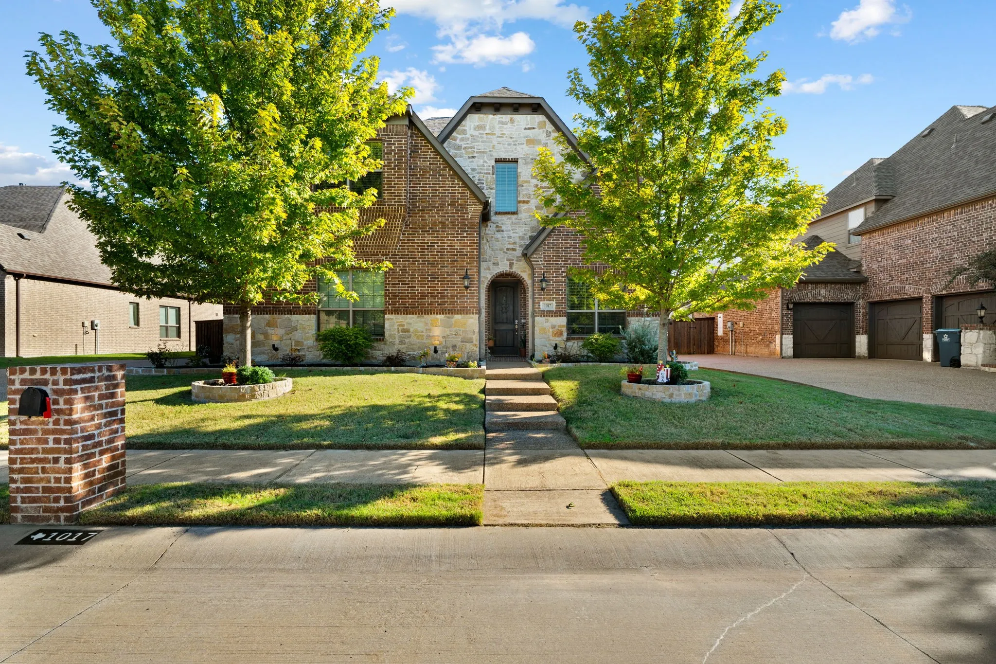 Brick and stone exterior with arched entry