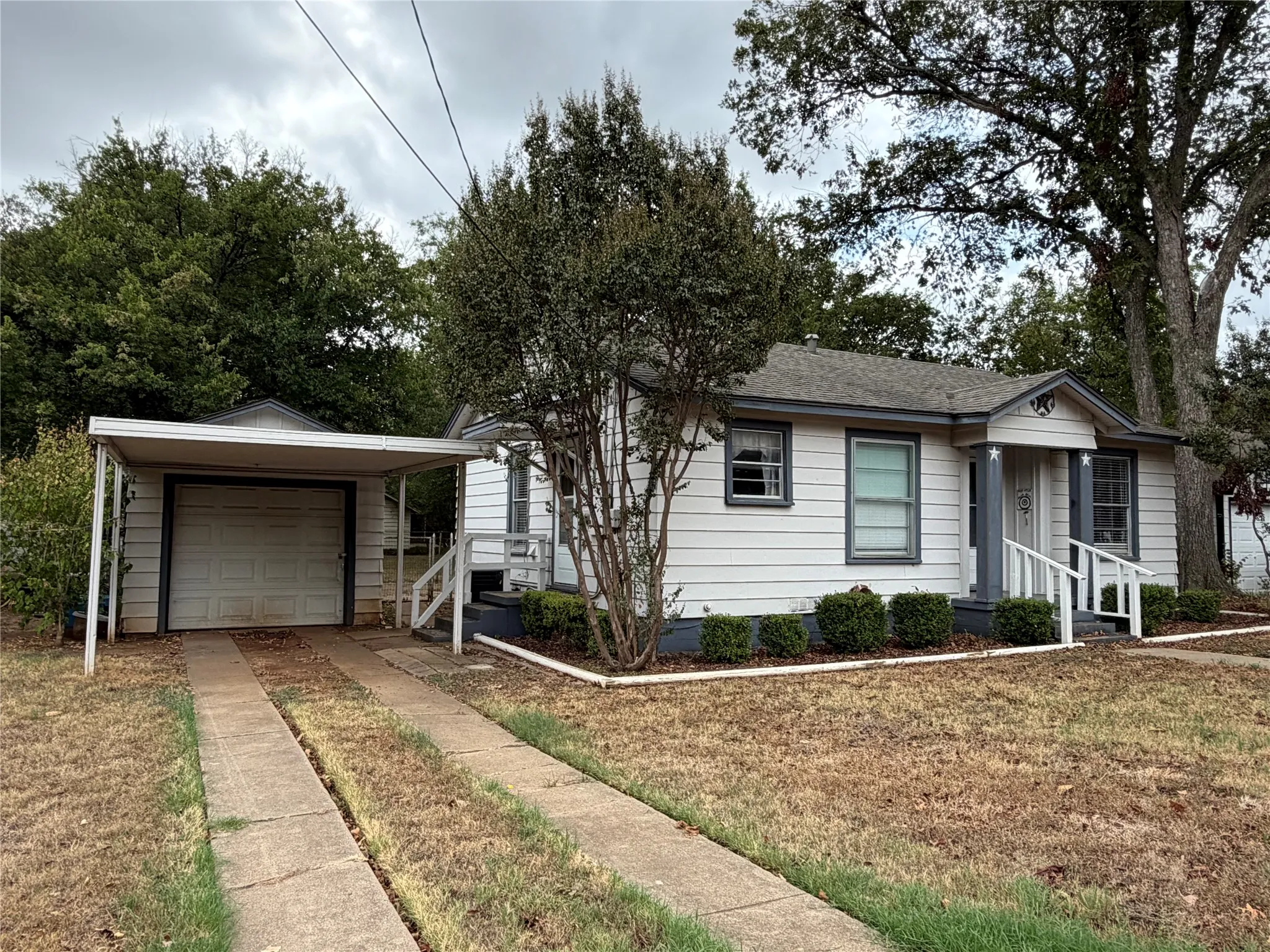White exterior siding with dark trim accents