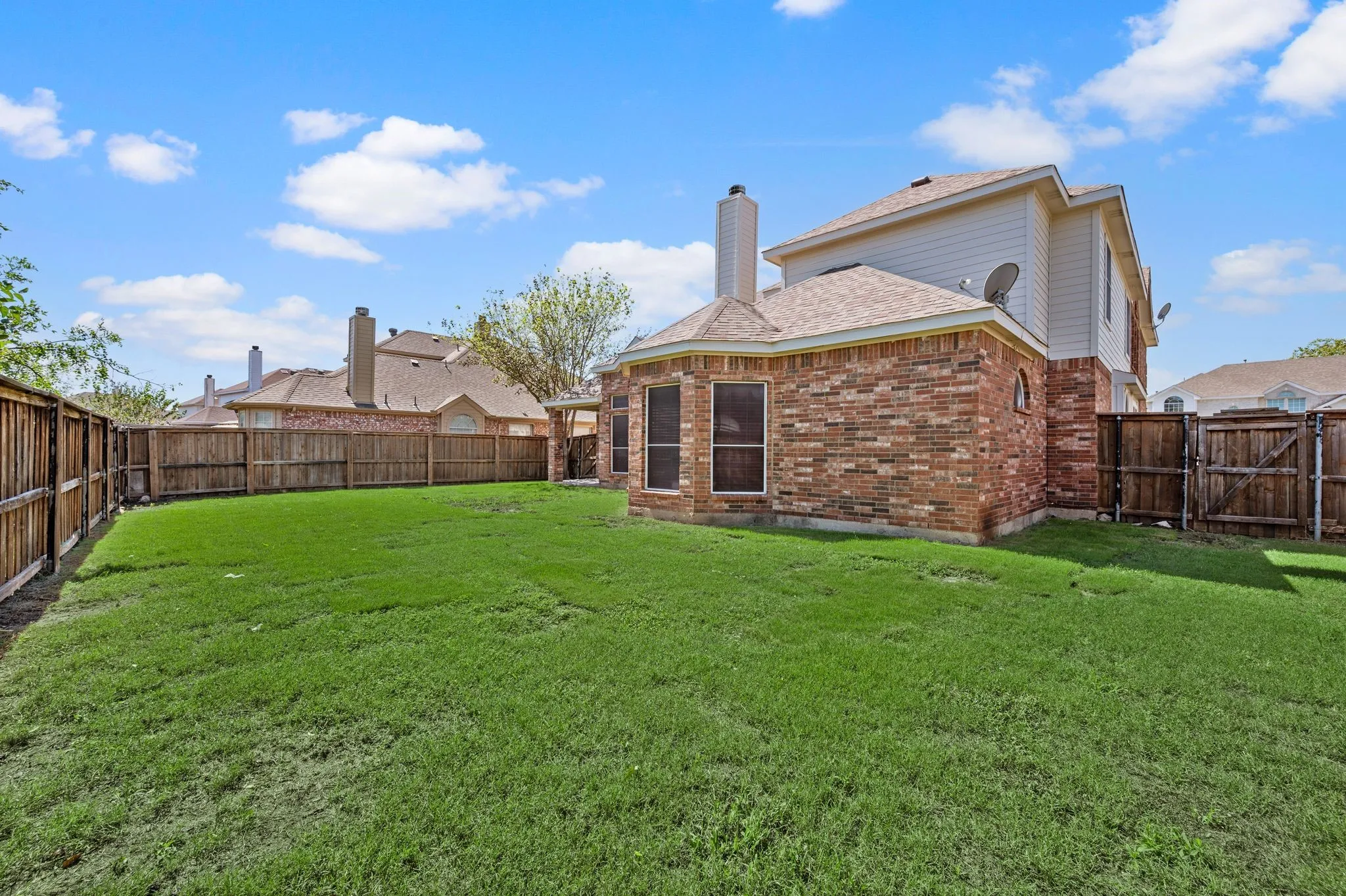 So much room to enjoy! This expansive backyard offers space for outdoor games, gardening & your favorite ways to unwind.