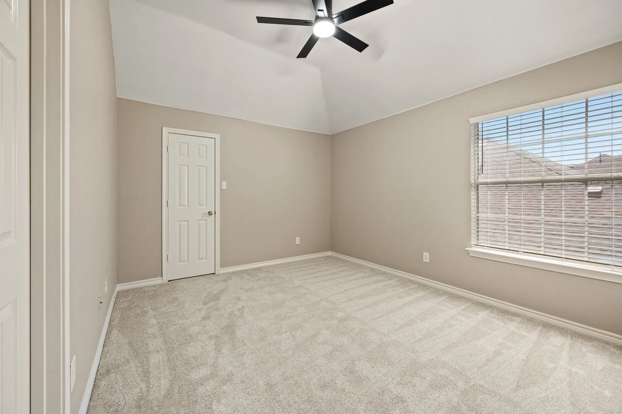 Settle into this inviting bedroom with a broad window, new carpet & plenty of space to create your own comfortable retreat.