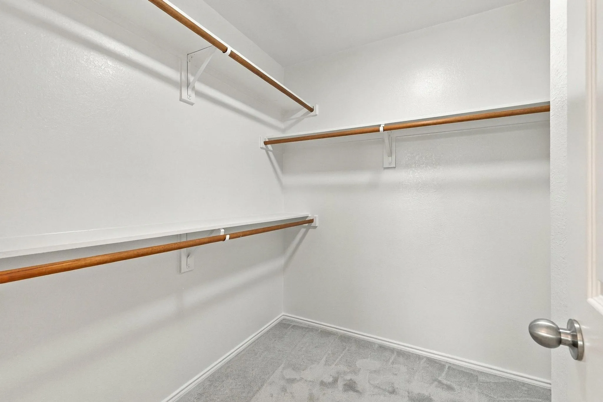 Spacious walk-in closets in the primary bedroom offer plenty of room for clothing and storage.