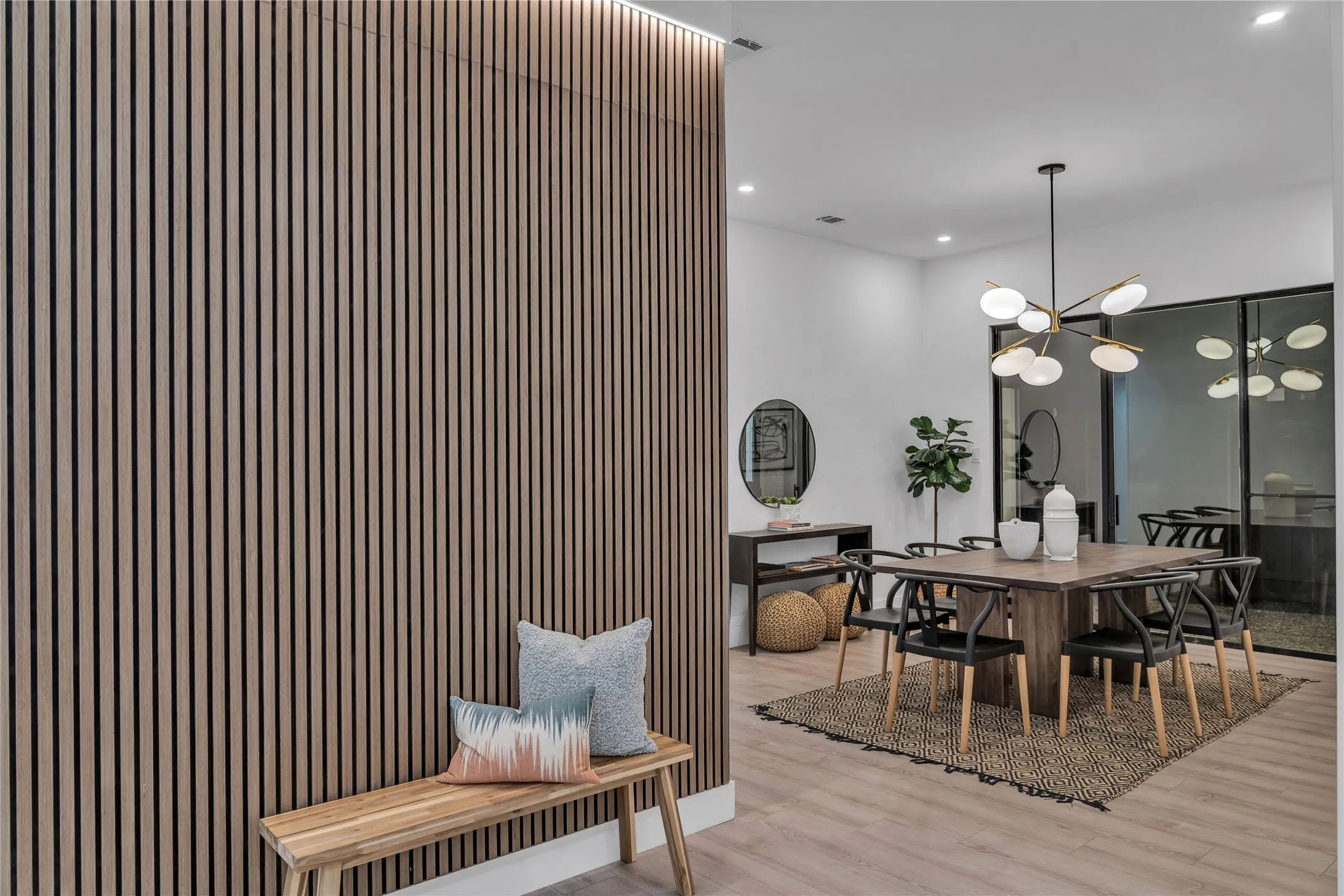 Dining area featuring an inviting chandelier and light wood-type flooring