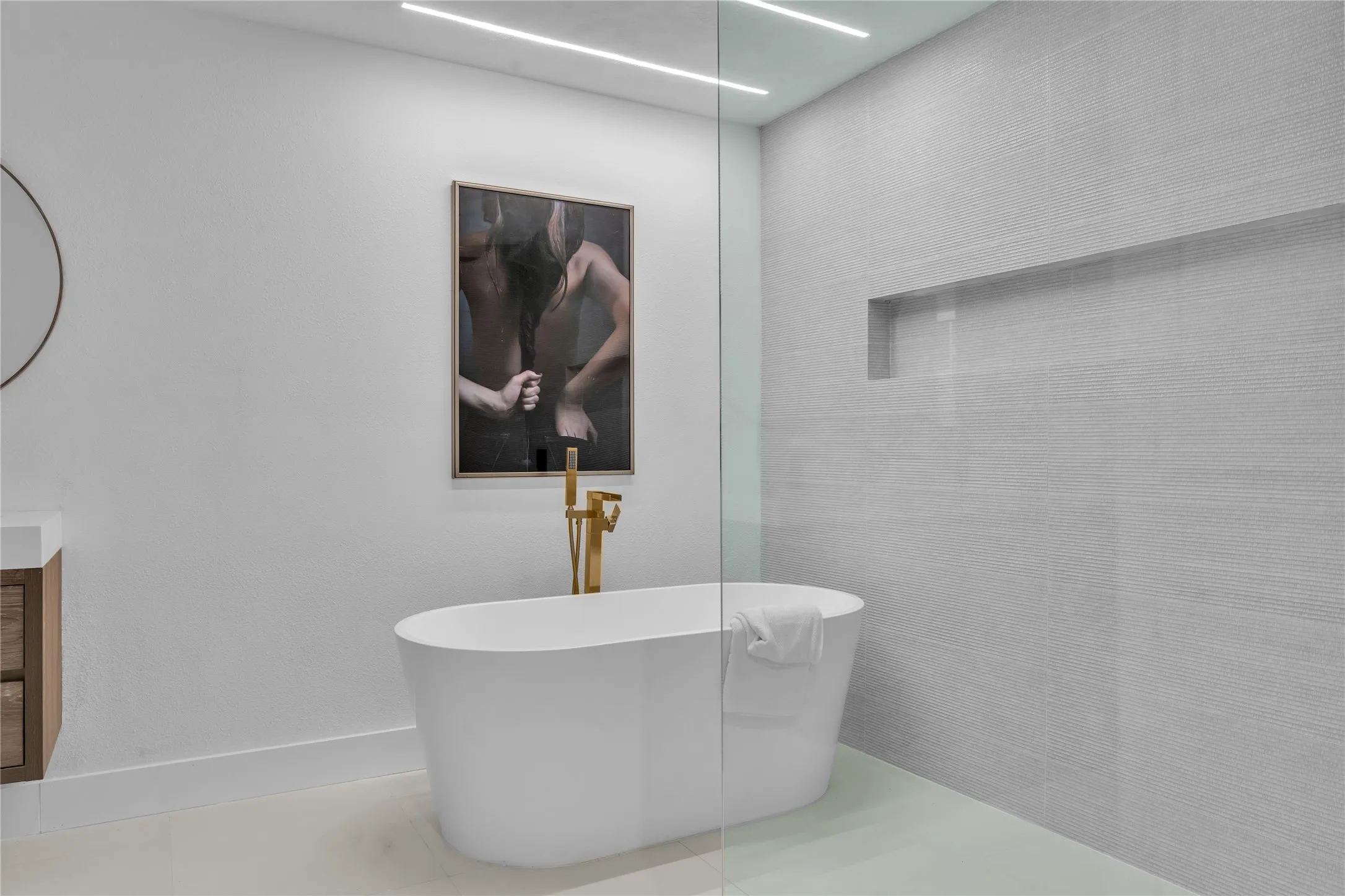 Bathroom featuring tile patterned flooring and a bathing tub