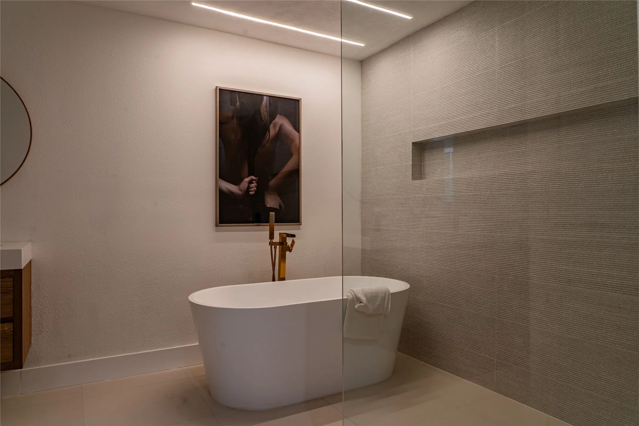 Bathroom featuring tile patterned flooring and a bathing tub