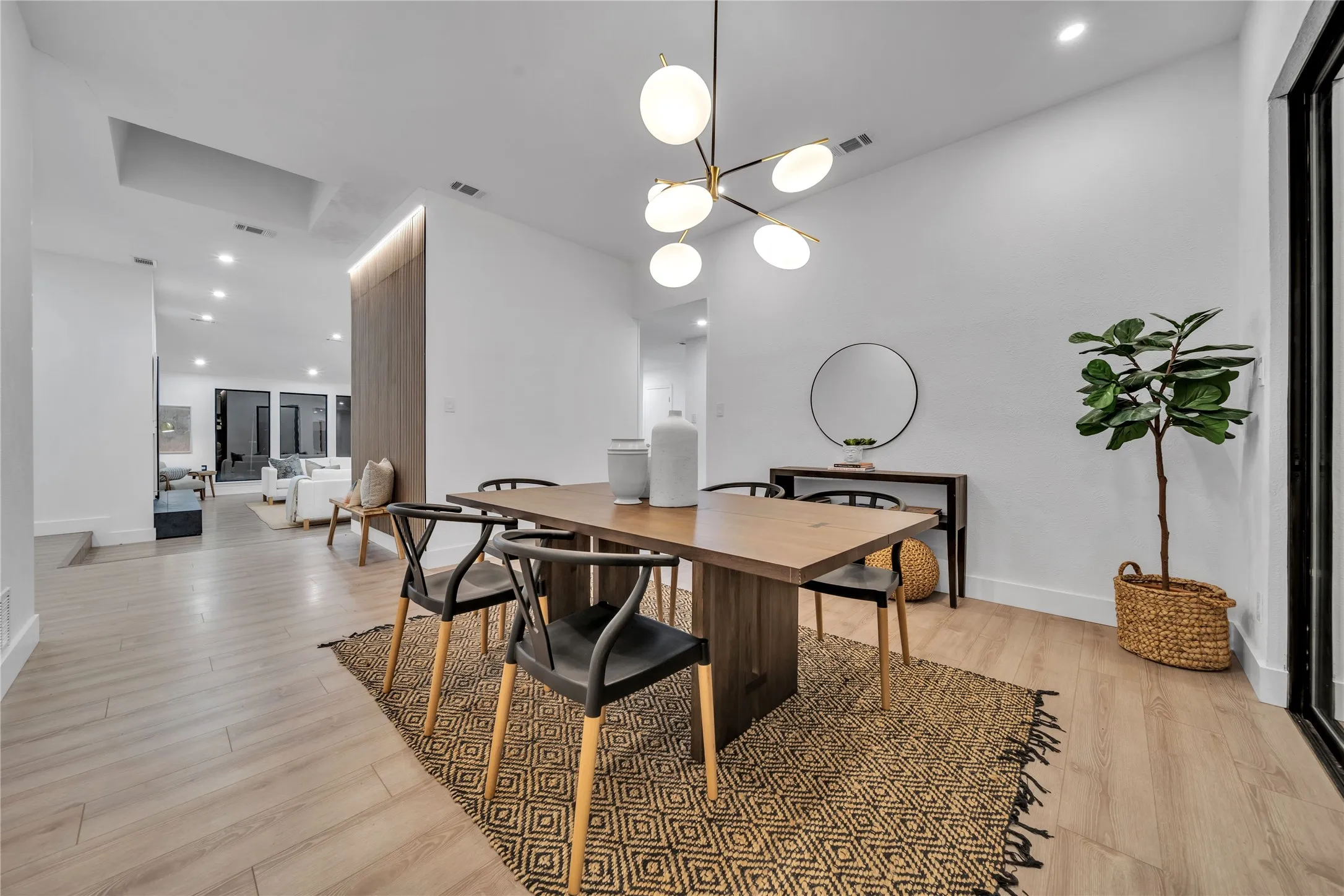 Dining room featuring a chandelier and light hardwood / wood-style flooring