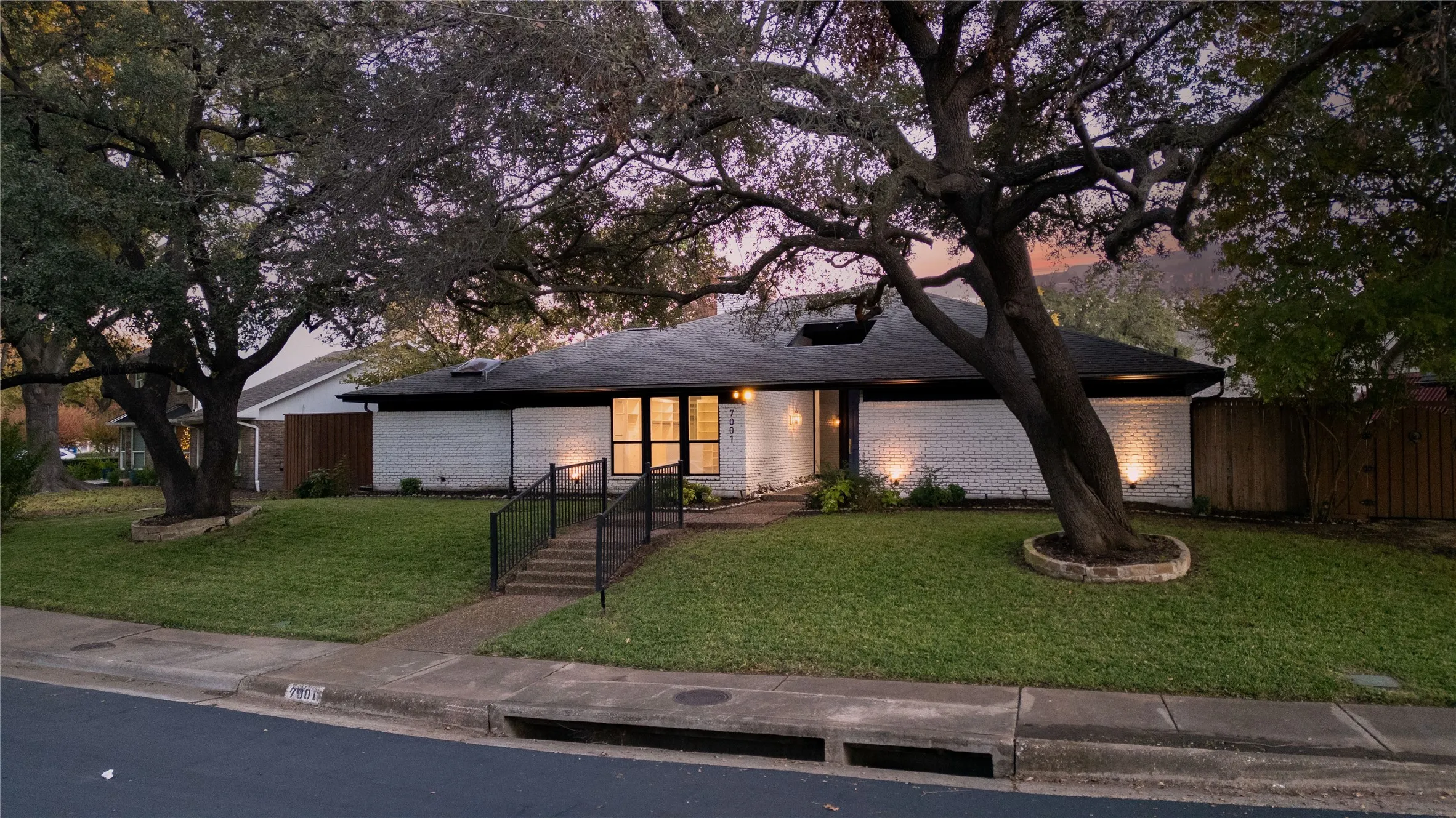 View of front of property featuring a lawn