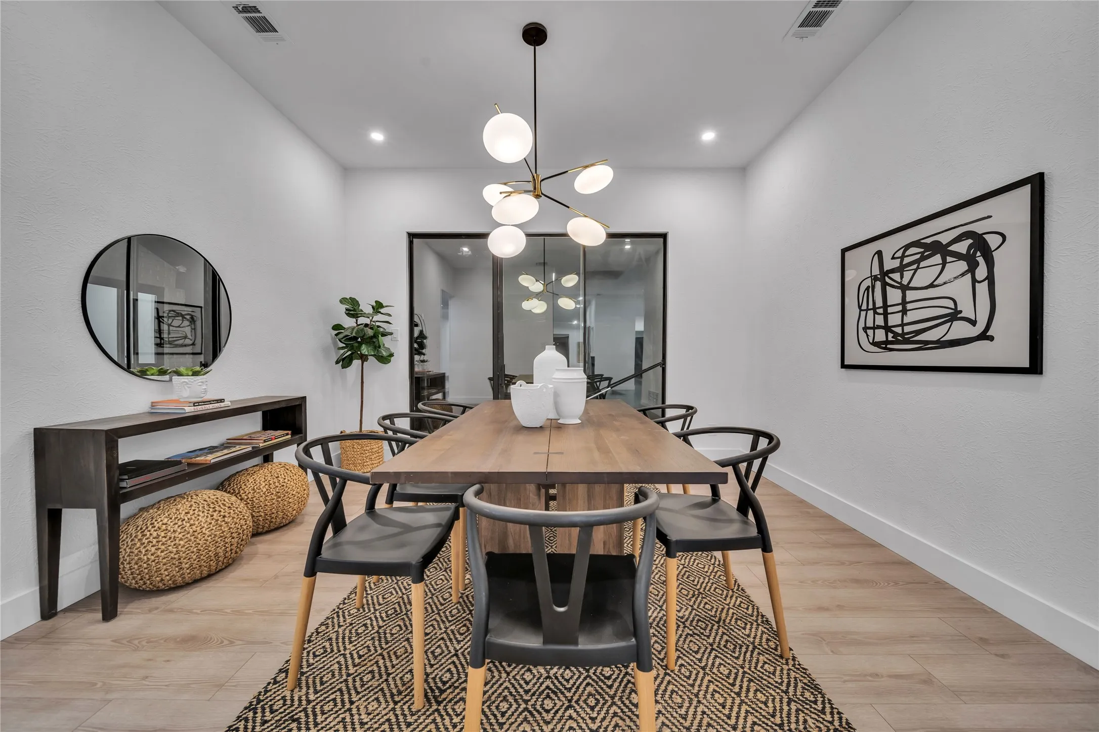 Dining room featuring light hardwood / wood-style flooring and a chandelier