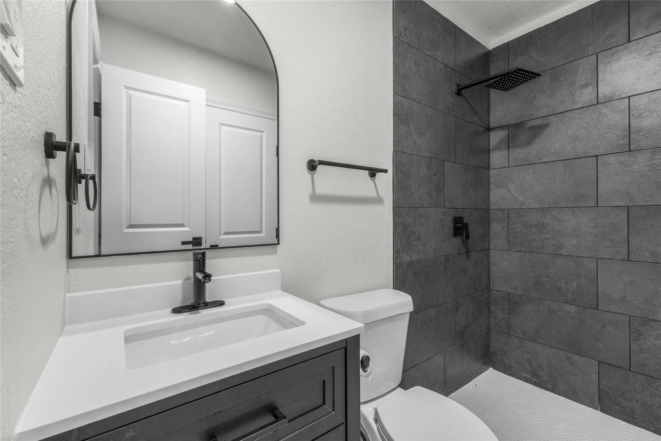 Modern vanity with a white countertop and integrated sink