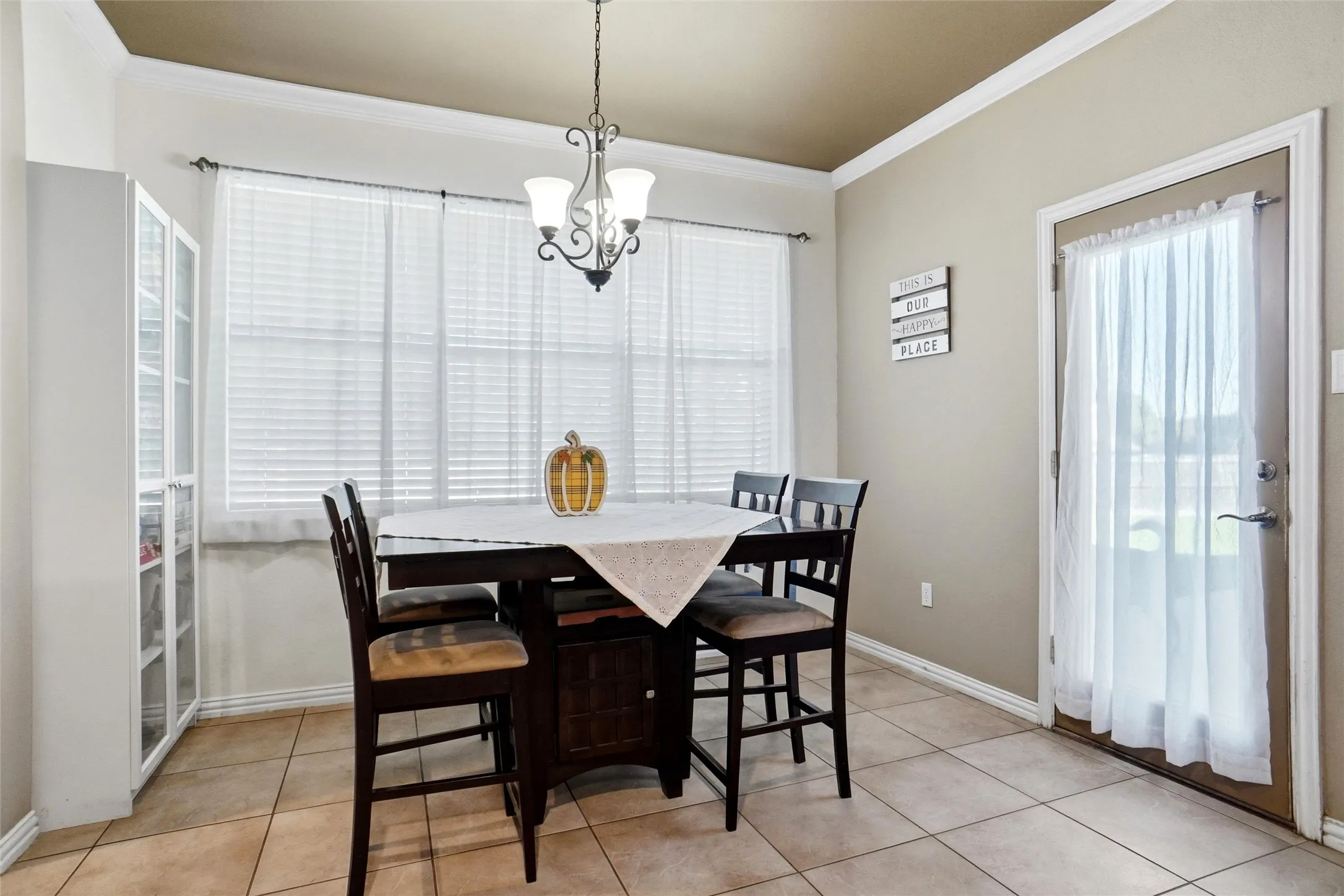 Large breakfast area with access to back patio, and built in display storage.