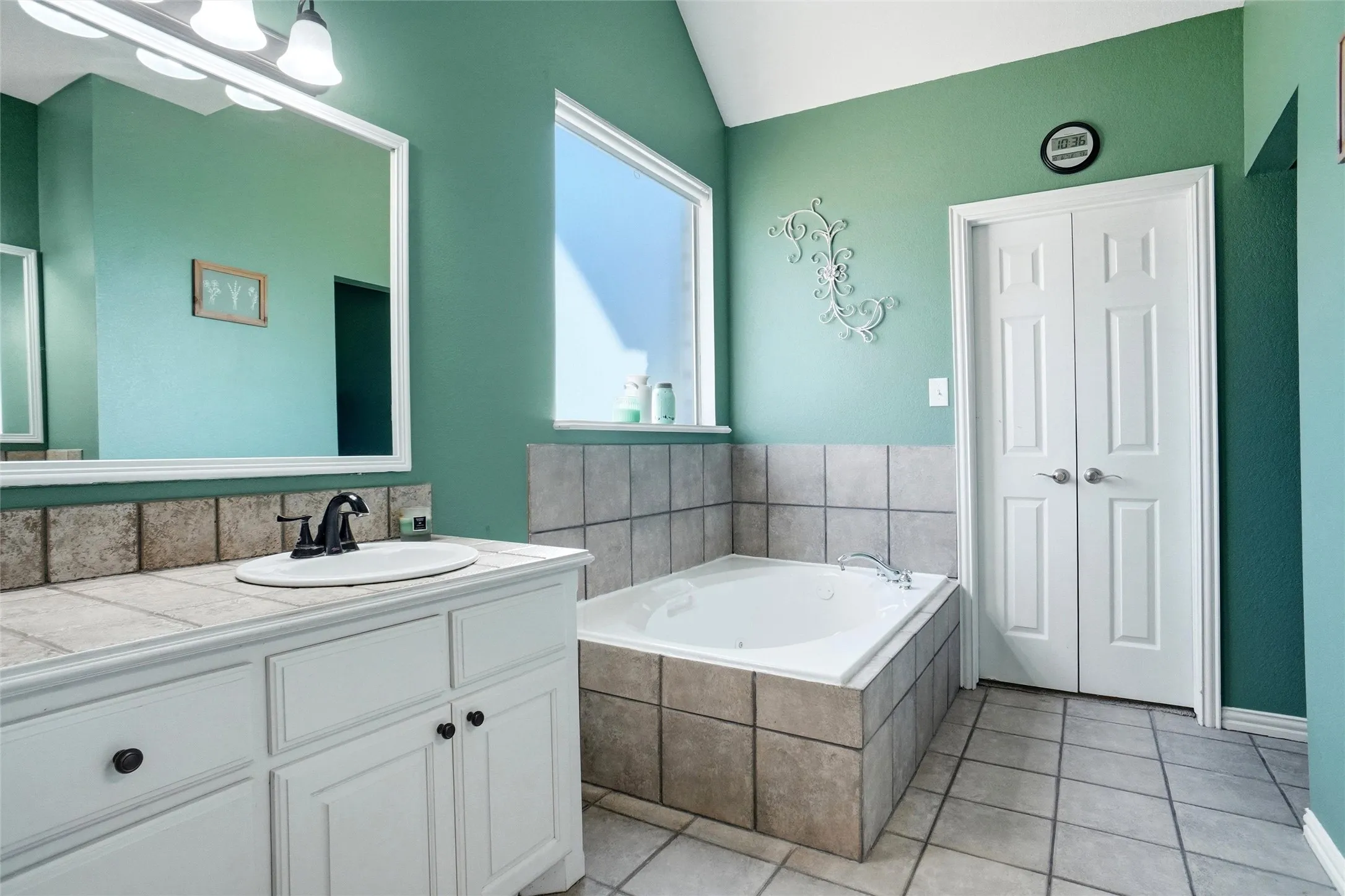 Primary bath with separate vanities, jetted tub and separate shower.