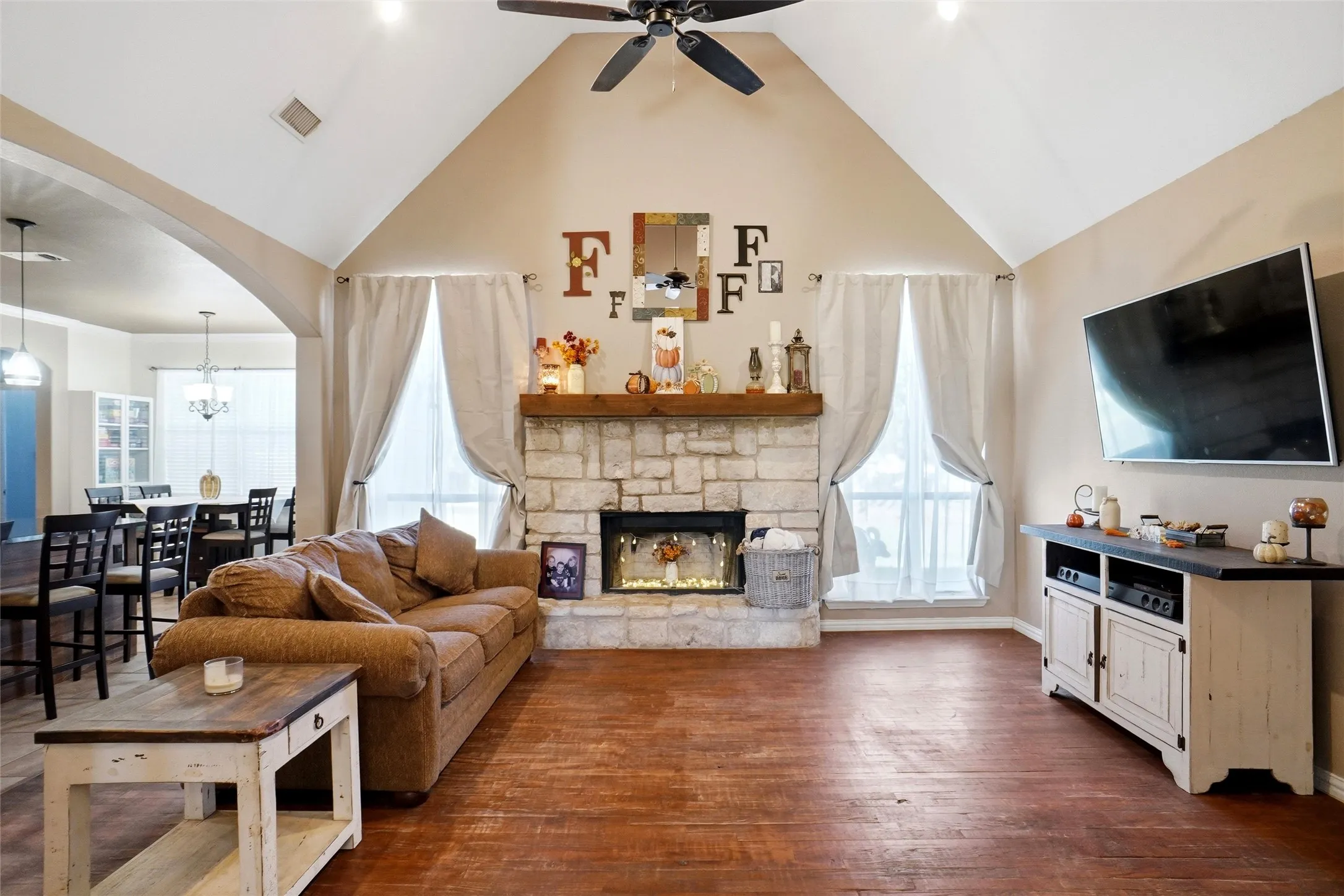 Woodburning fireplace, wood floors and vaulted ceilings!