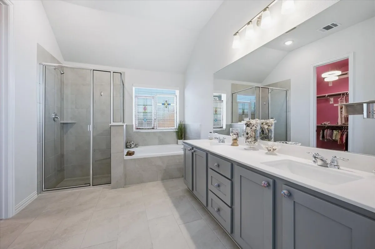 Master bathroom, Dual vanity with an expansive countertop, individual sinks, and abundant storage cabinetry