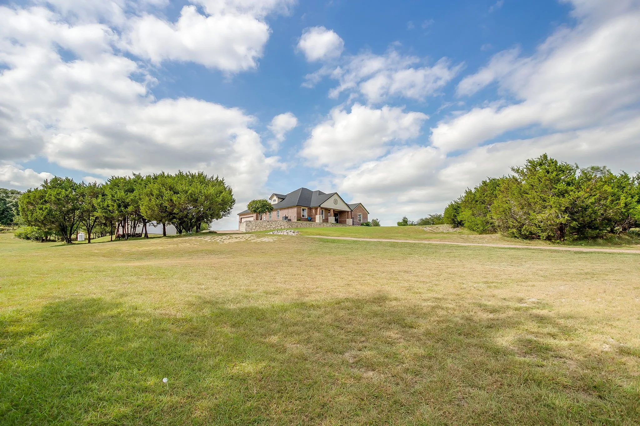 Expansive green space with mature trees