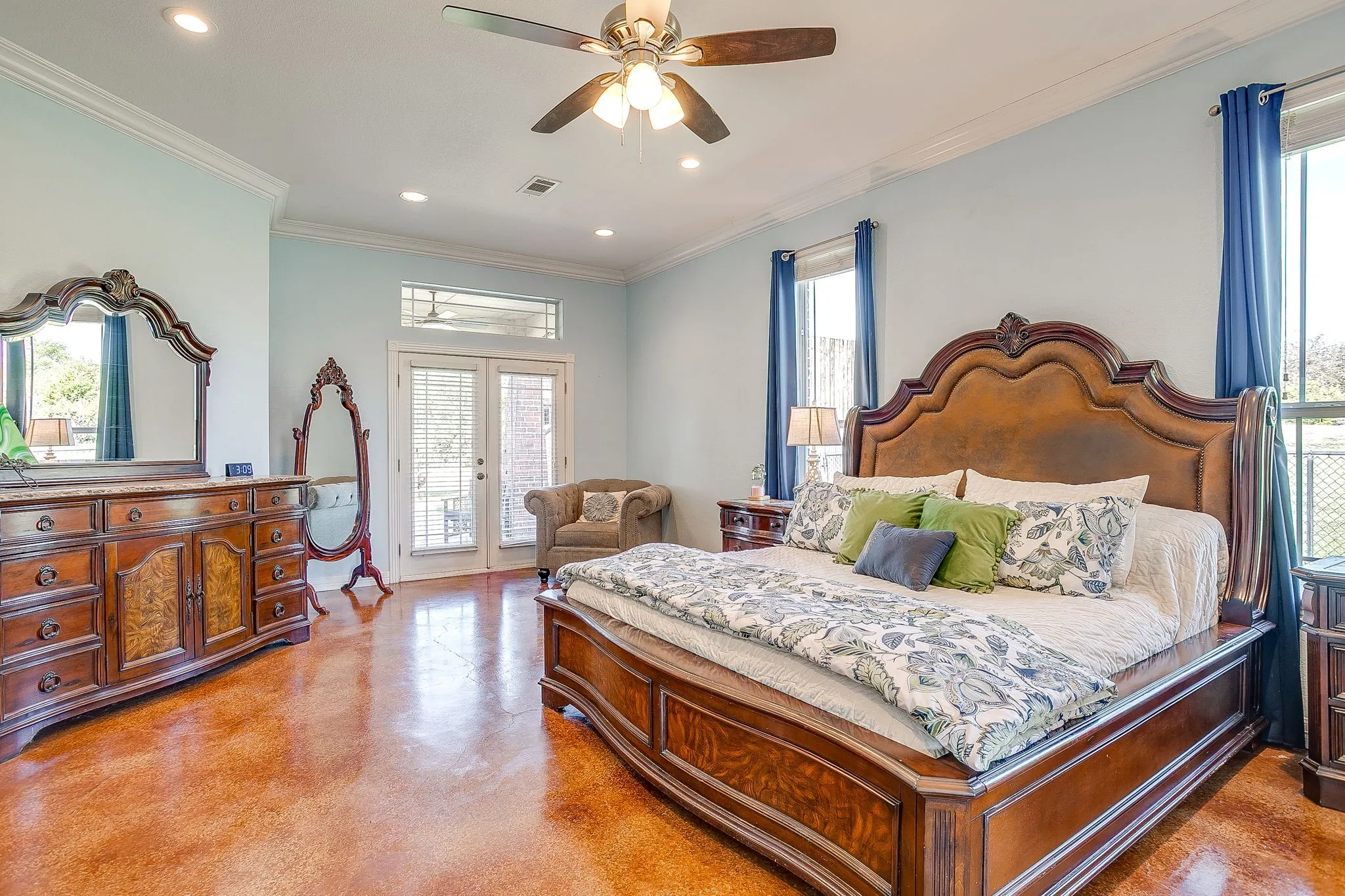 Recessed lighting, crown molding, double French doors, transom window, and a ceiling fan