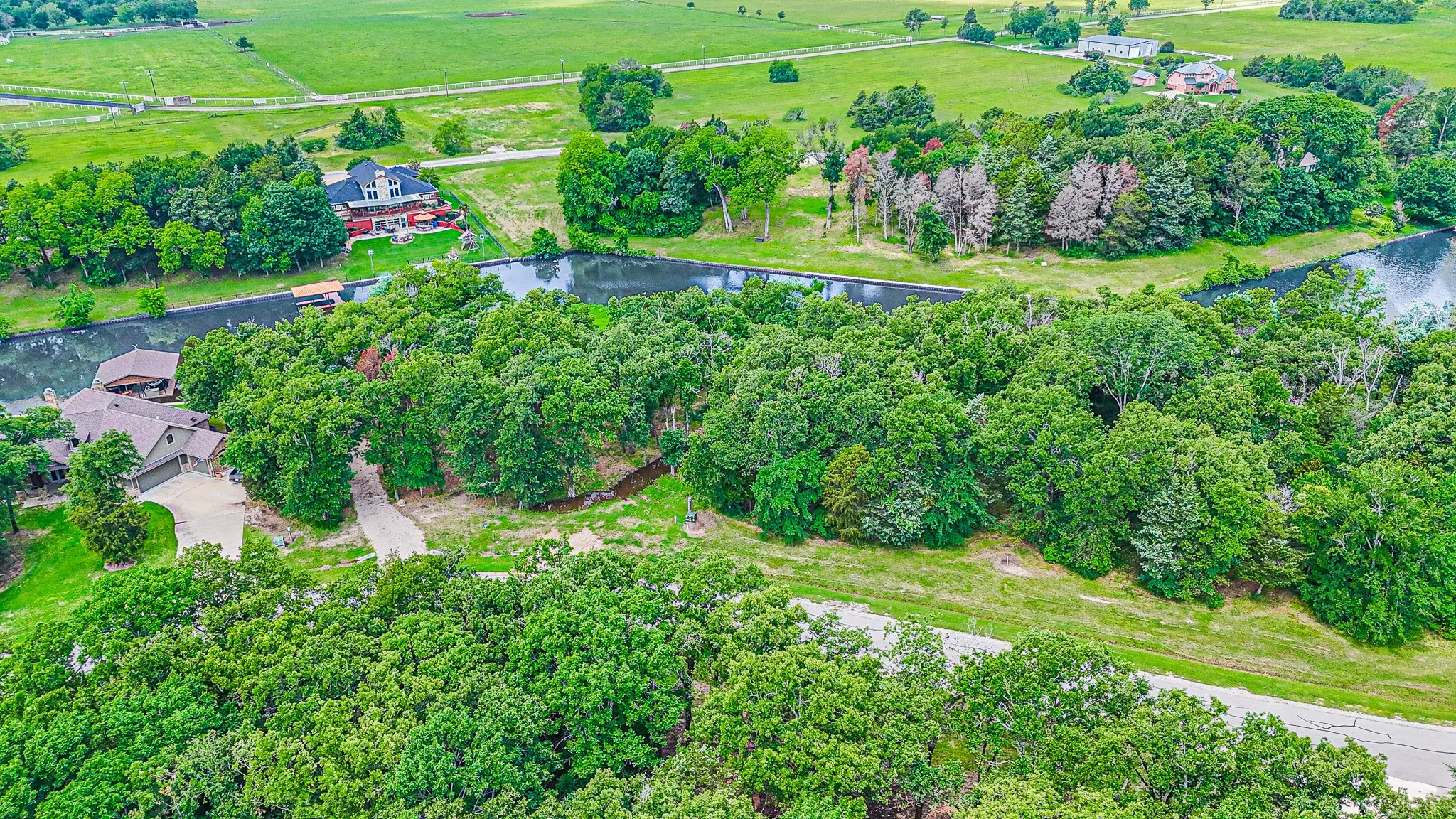 Drone / aerial view featuring a water view and a rural view